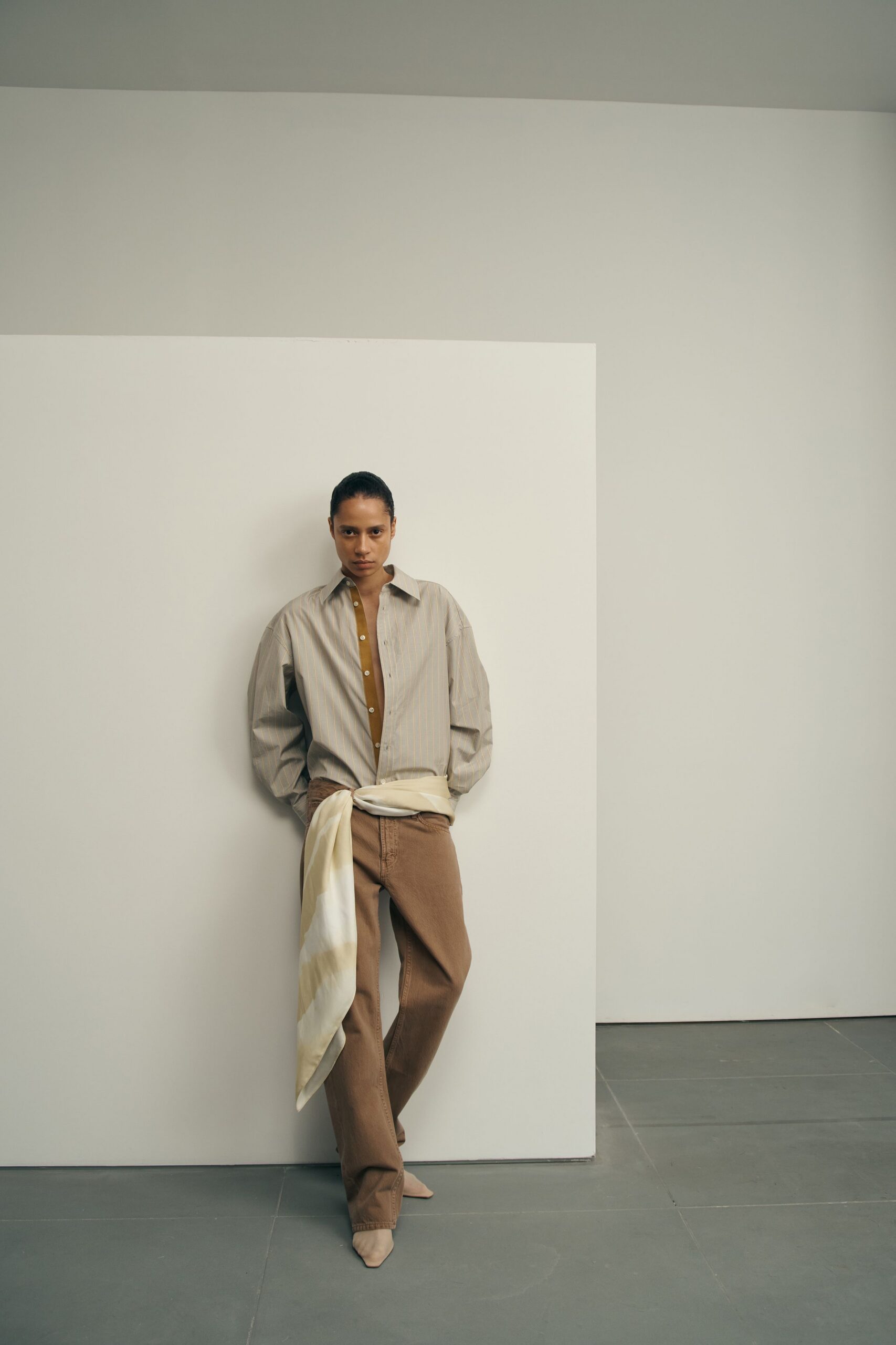 beige striped shirt with brown pants