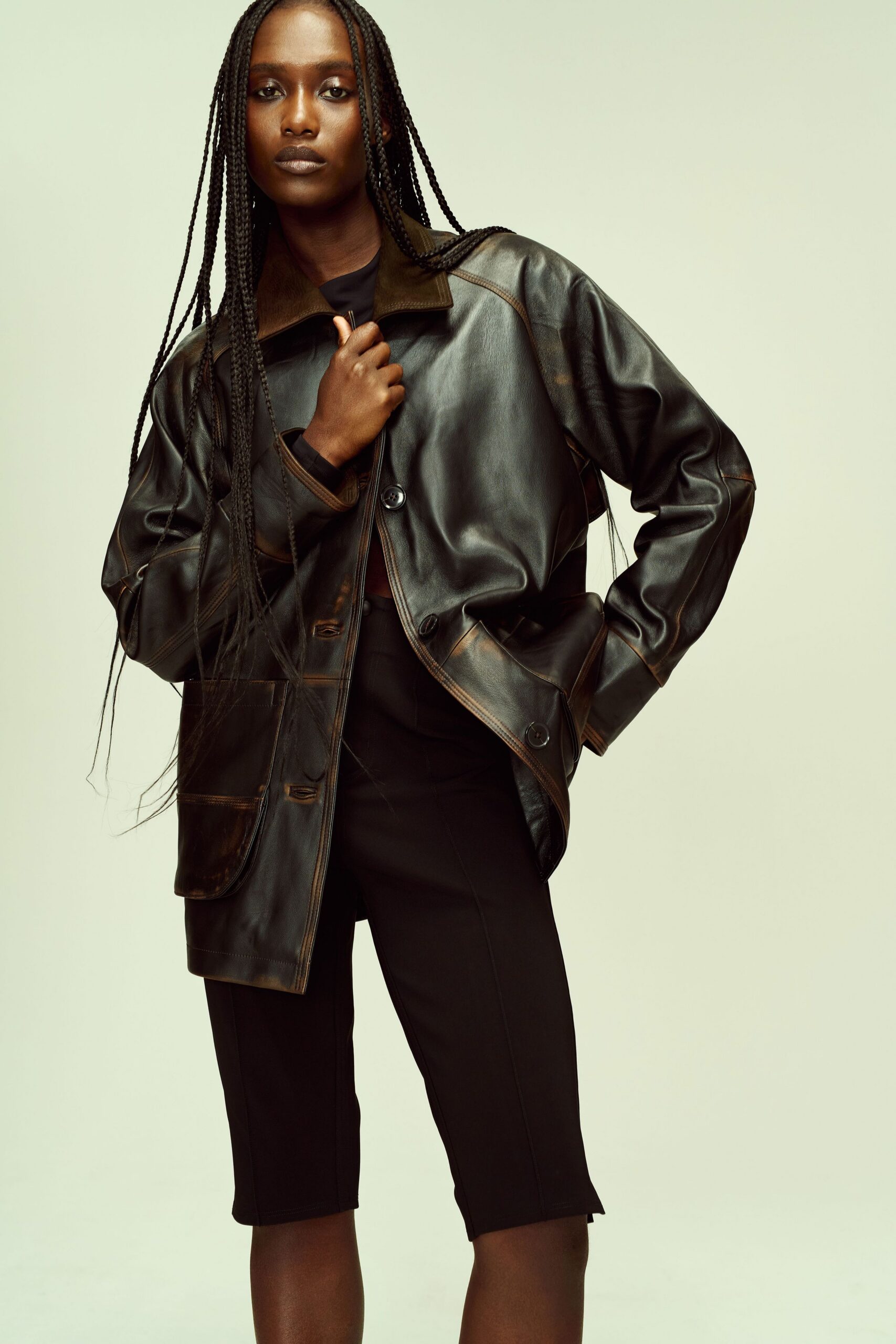 black leather long-sleeve collared oversized buttoned jacket