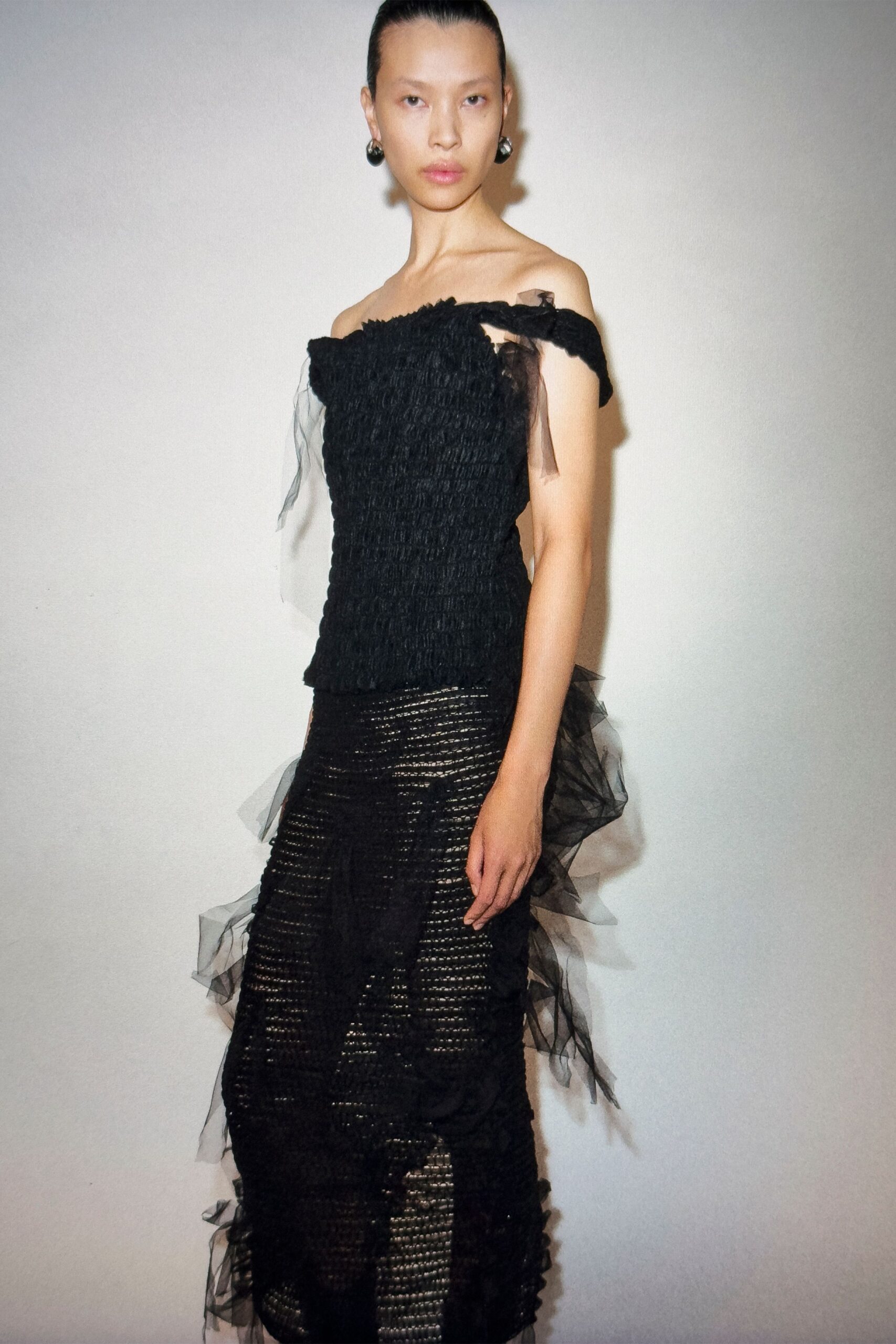 black silk sleeveless off-shoulder fitted ruffled top