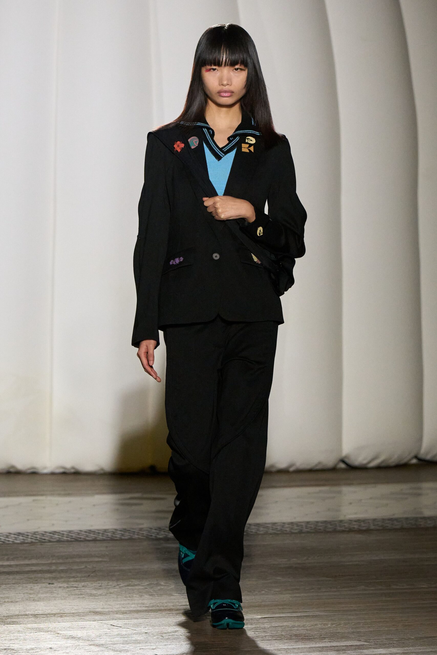 black tailored blazer with blue top