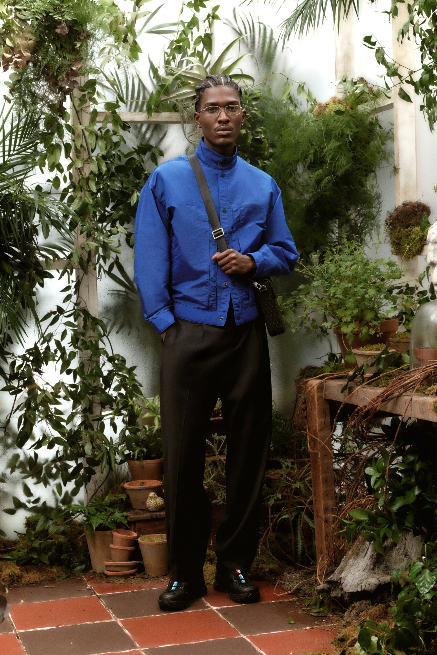 blue shirt black pants outfit