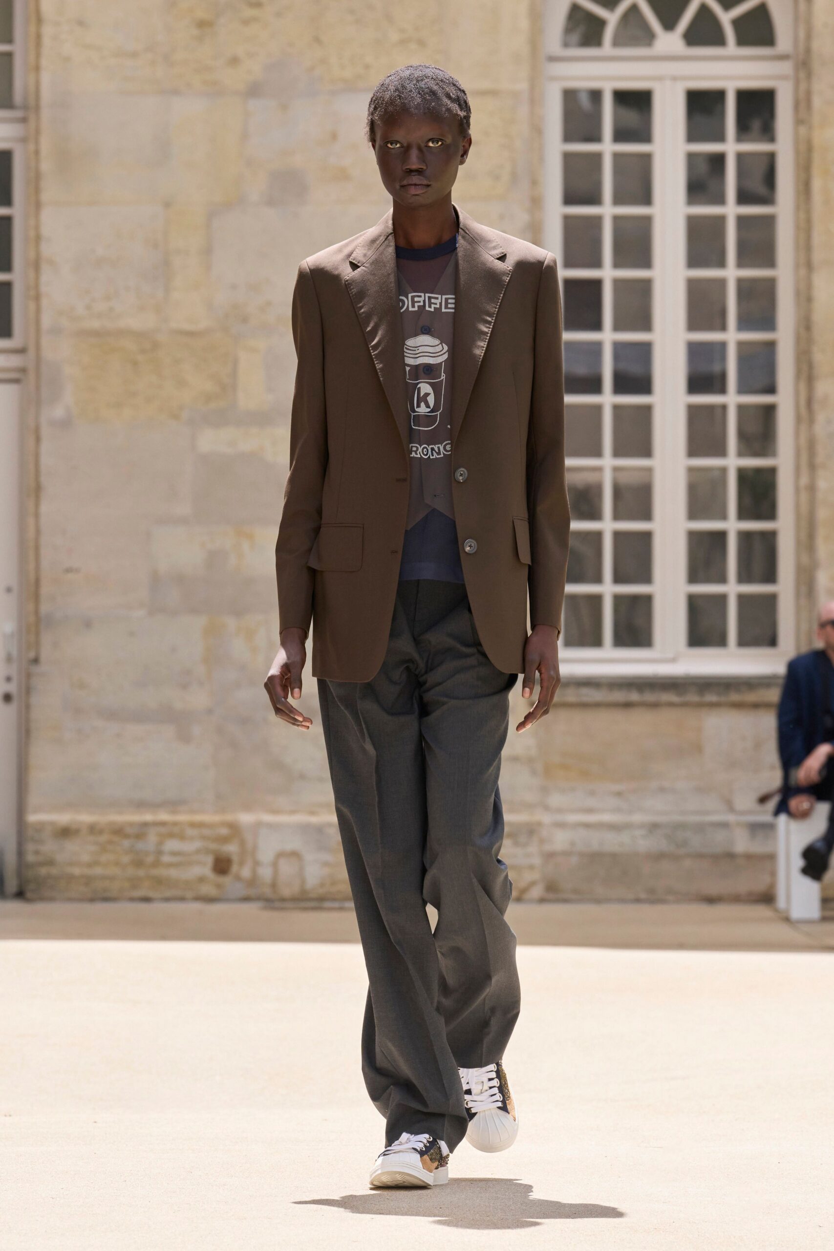 brown tailored blazer with gray pants