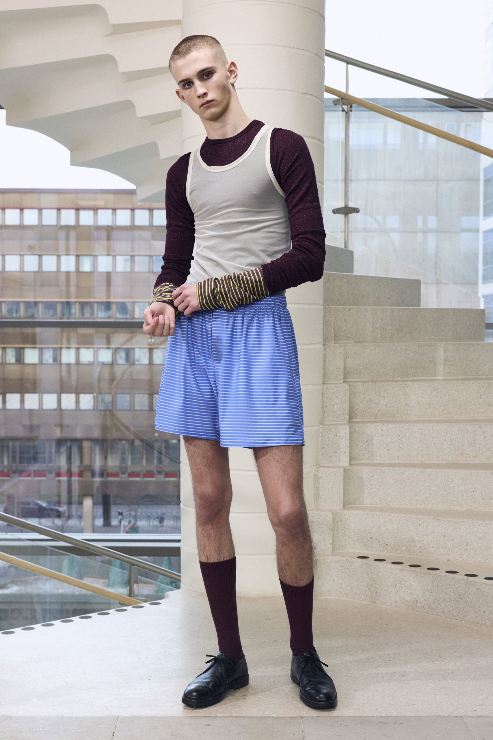 white tank-top maroon sweater blue shorts