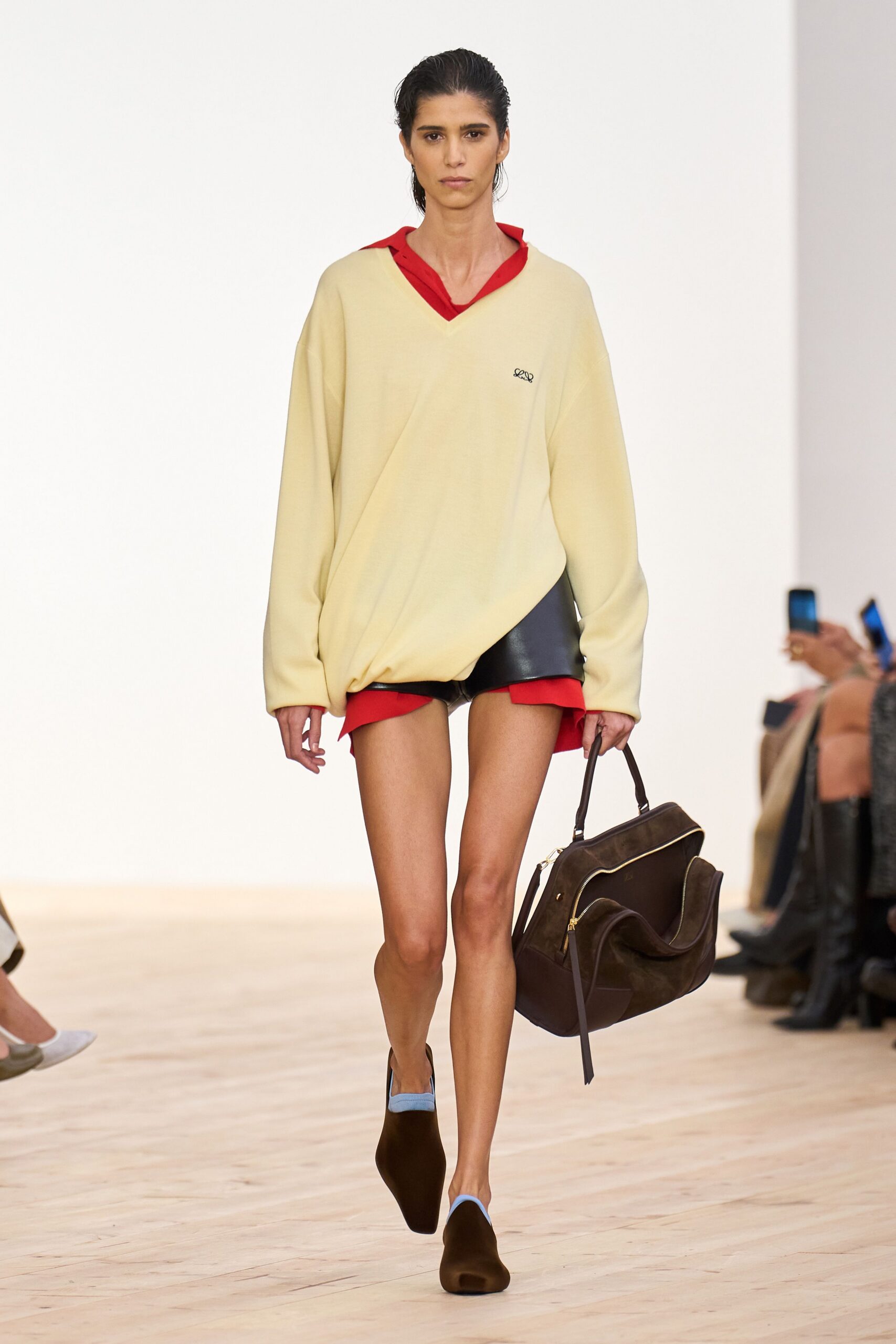 yellow oversized top with black shorts