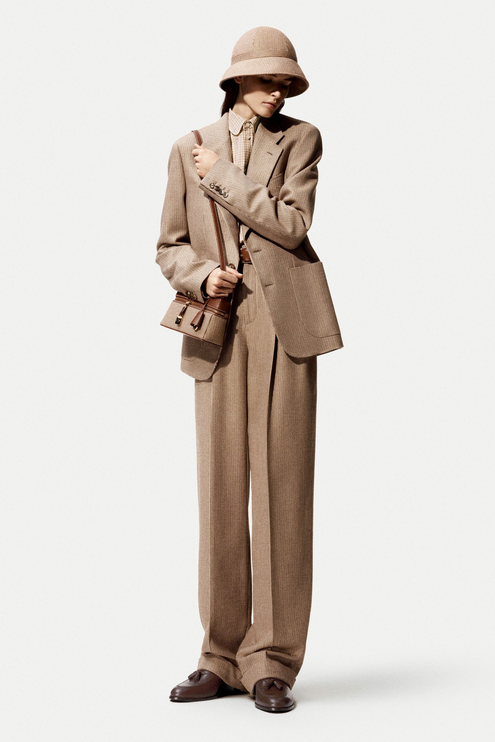 brown tailored suit with hat