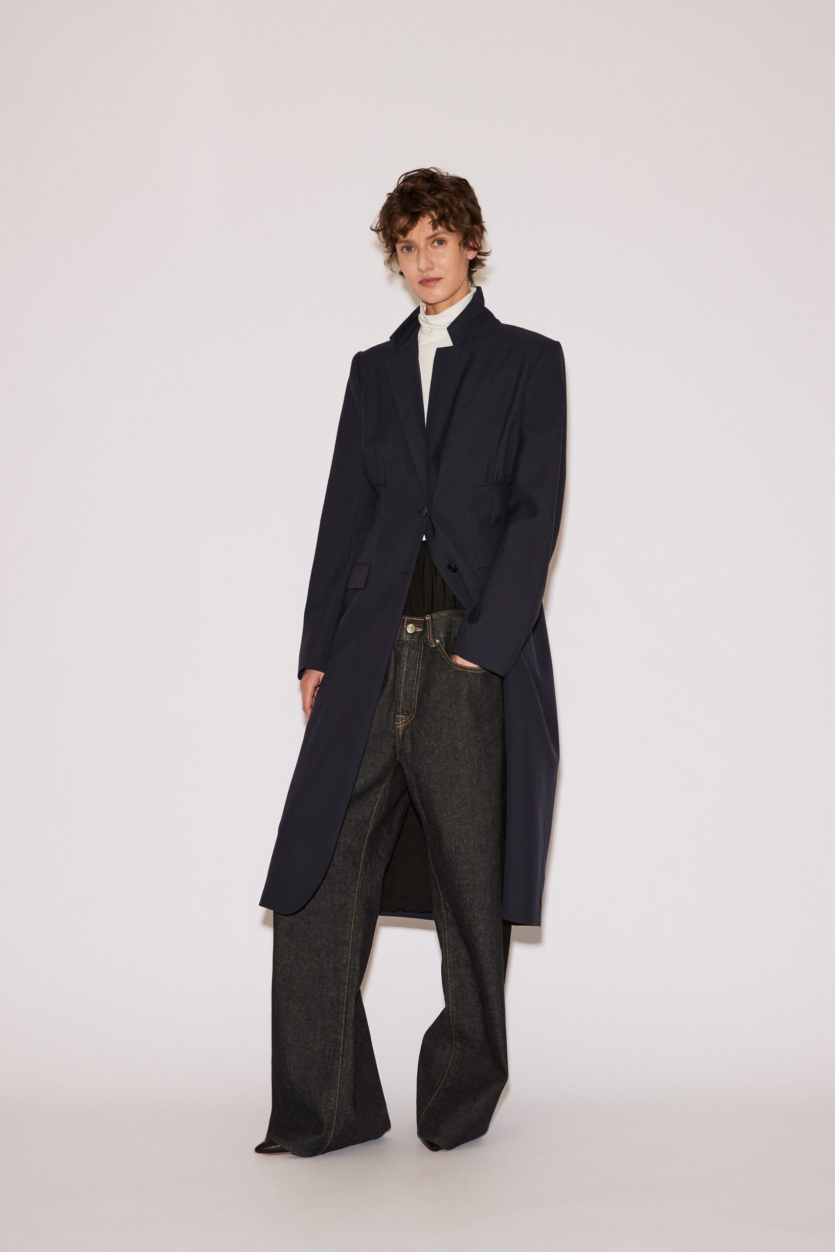 navy coat white top gray pants