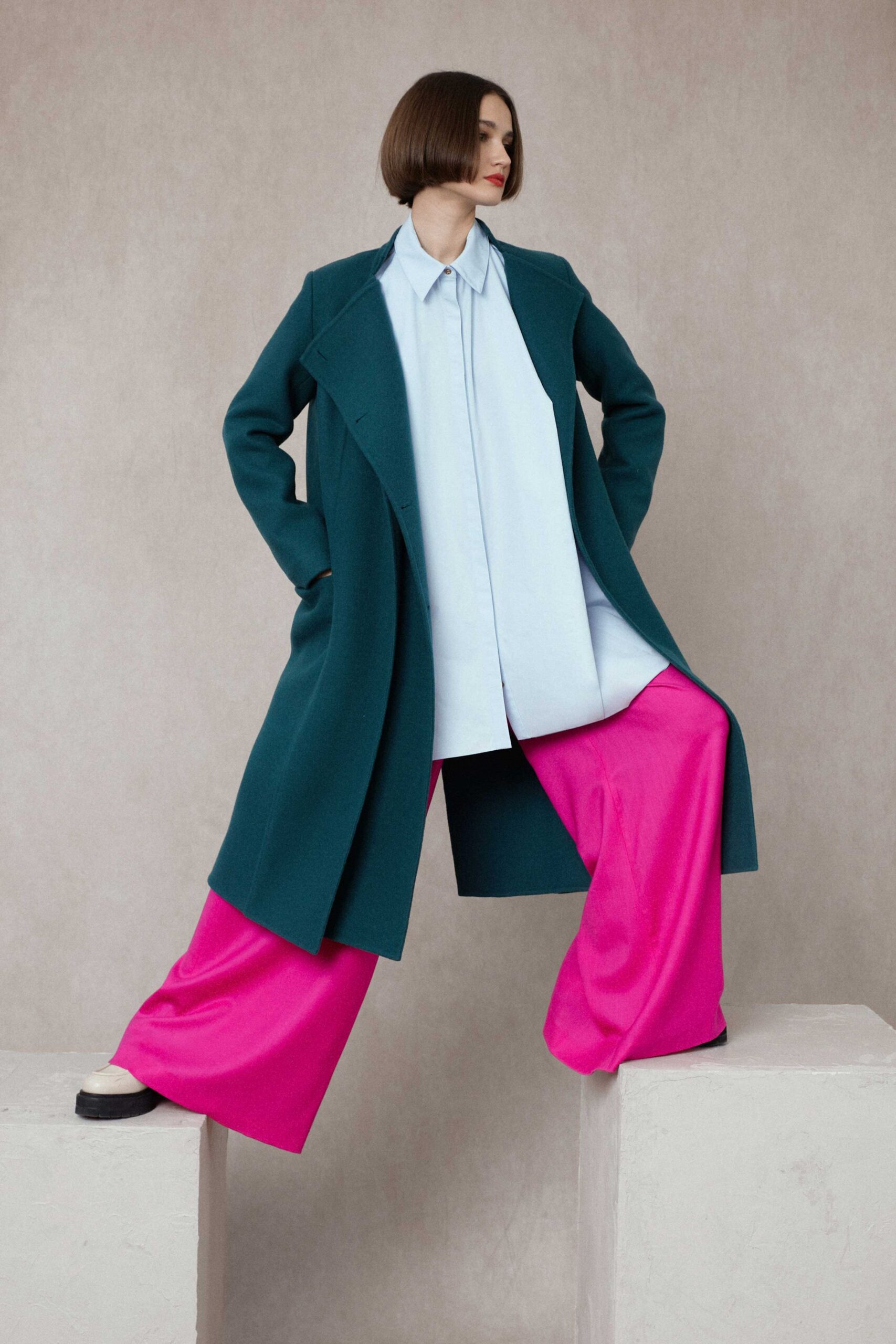 green coat blue shirt pink pants