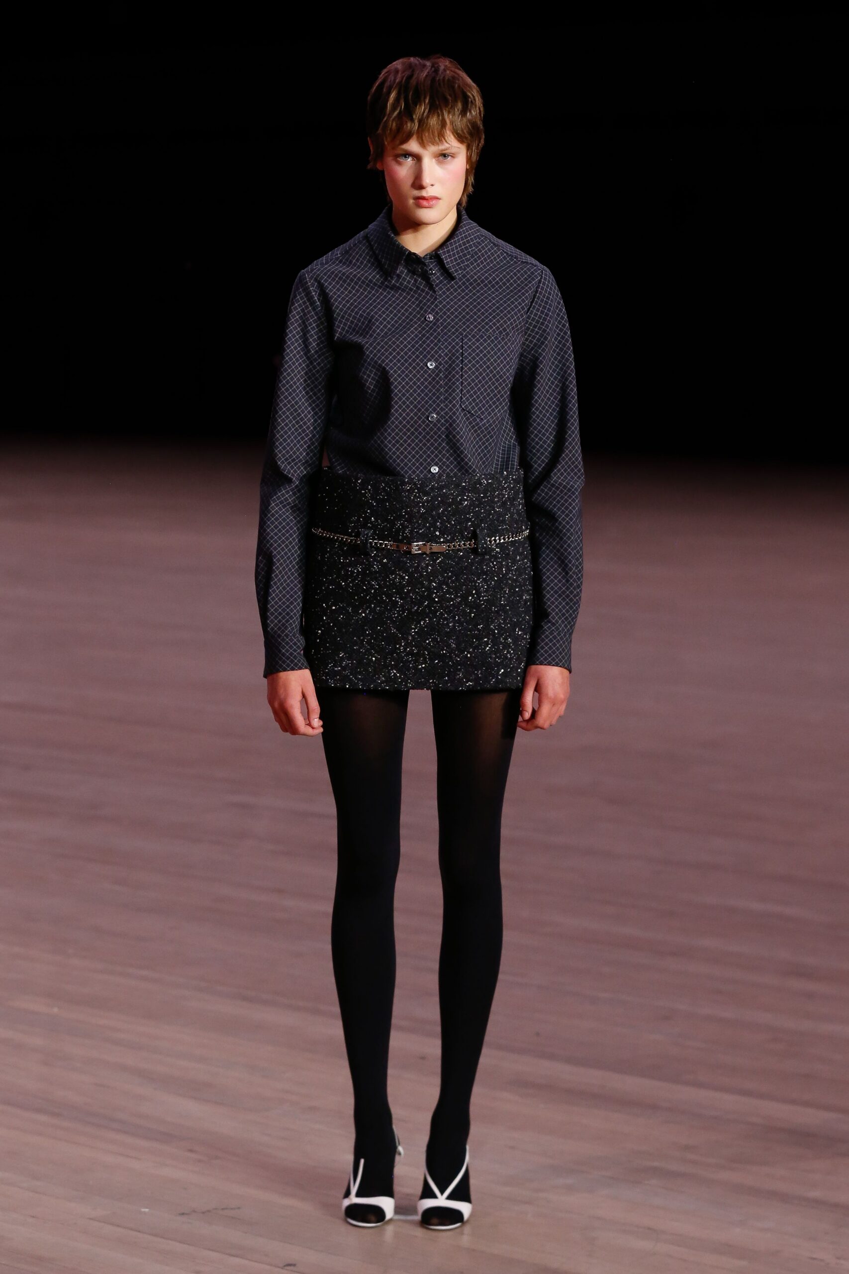 black and white polka-dot shirt with mini skirt
