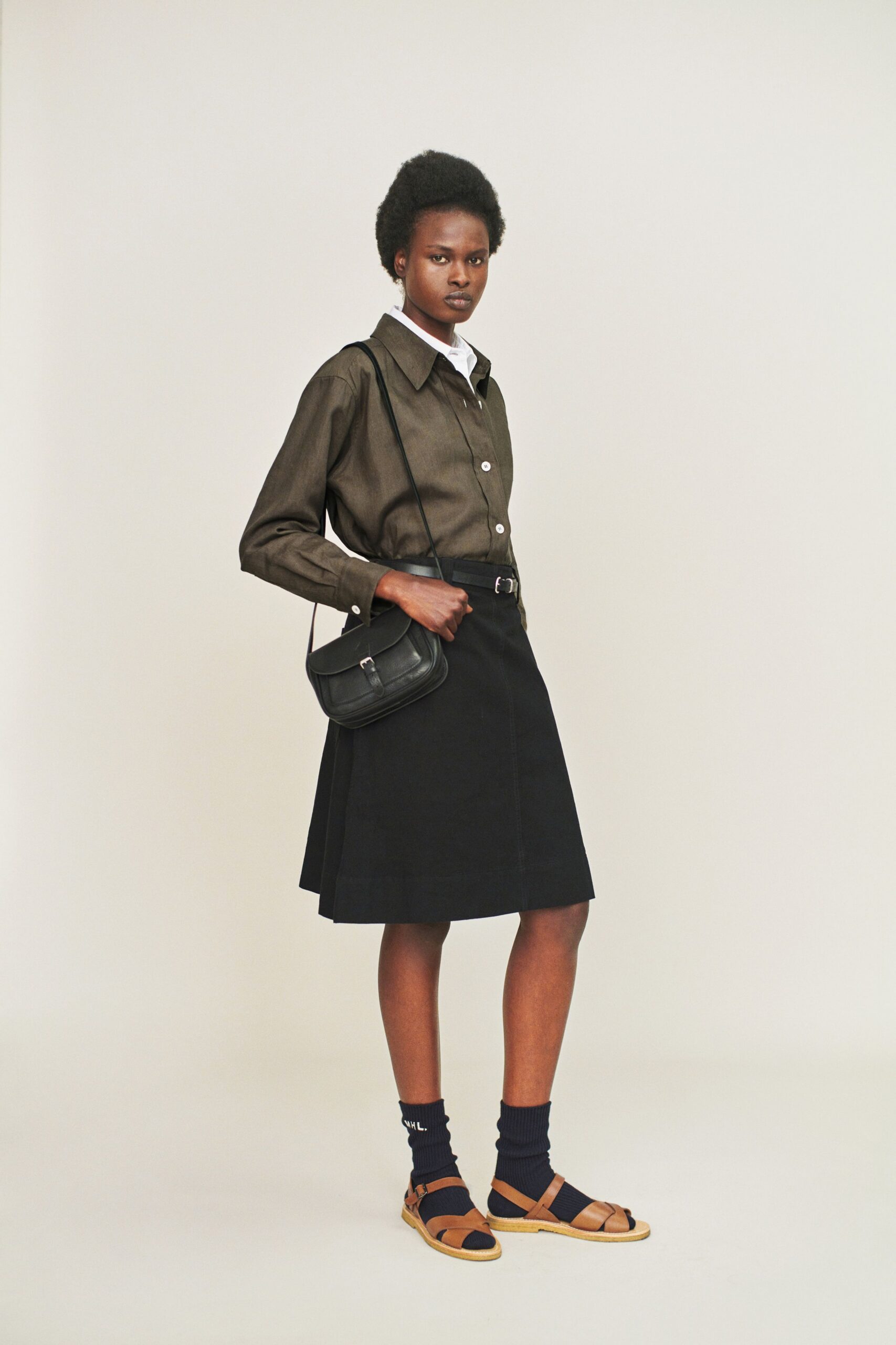 brown cotton shirt black pleated skirt