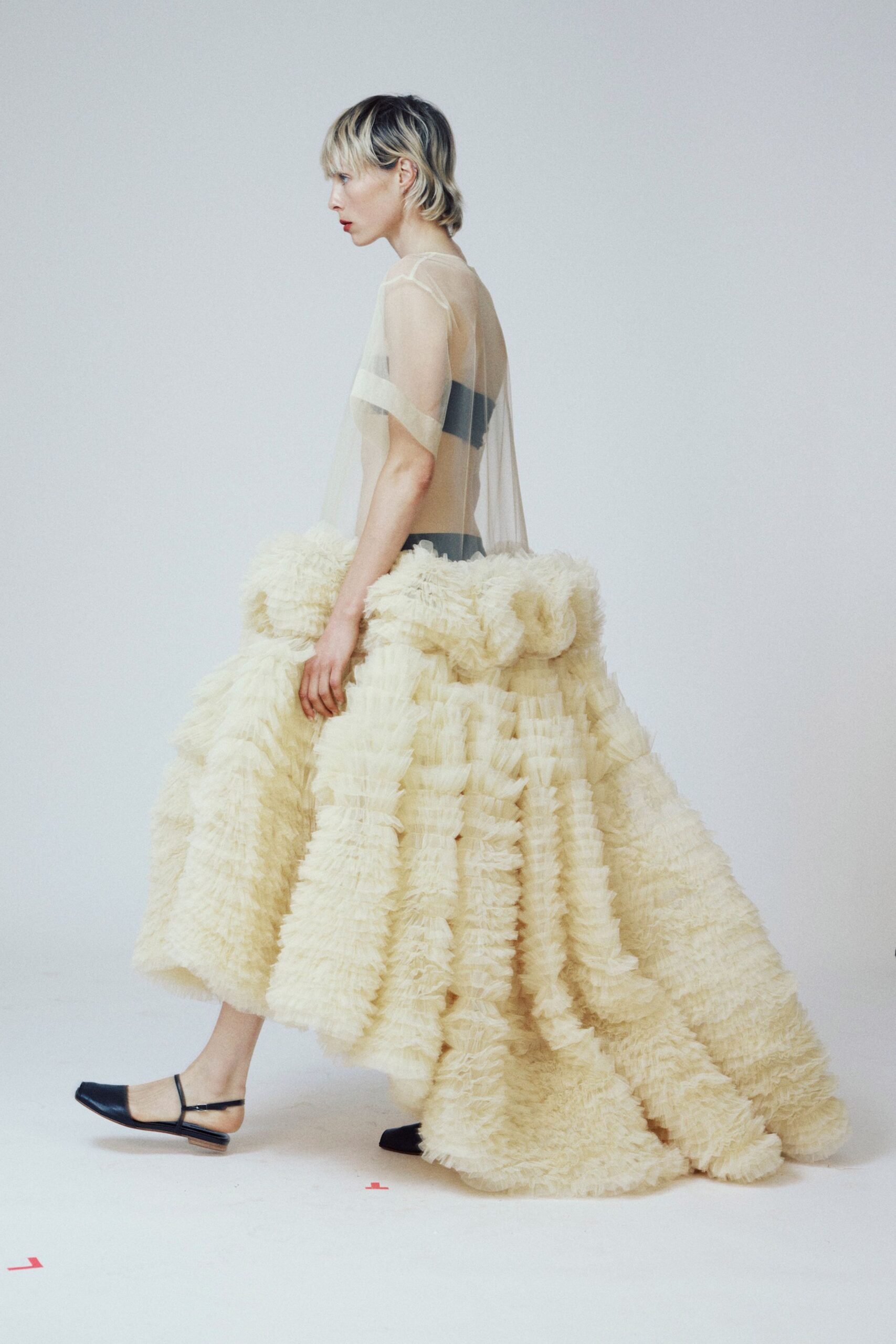 ivory tulle sleeveless fitted ruffled flowing maxi gown