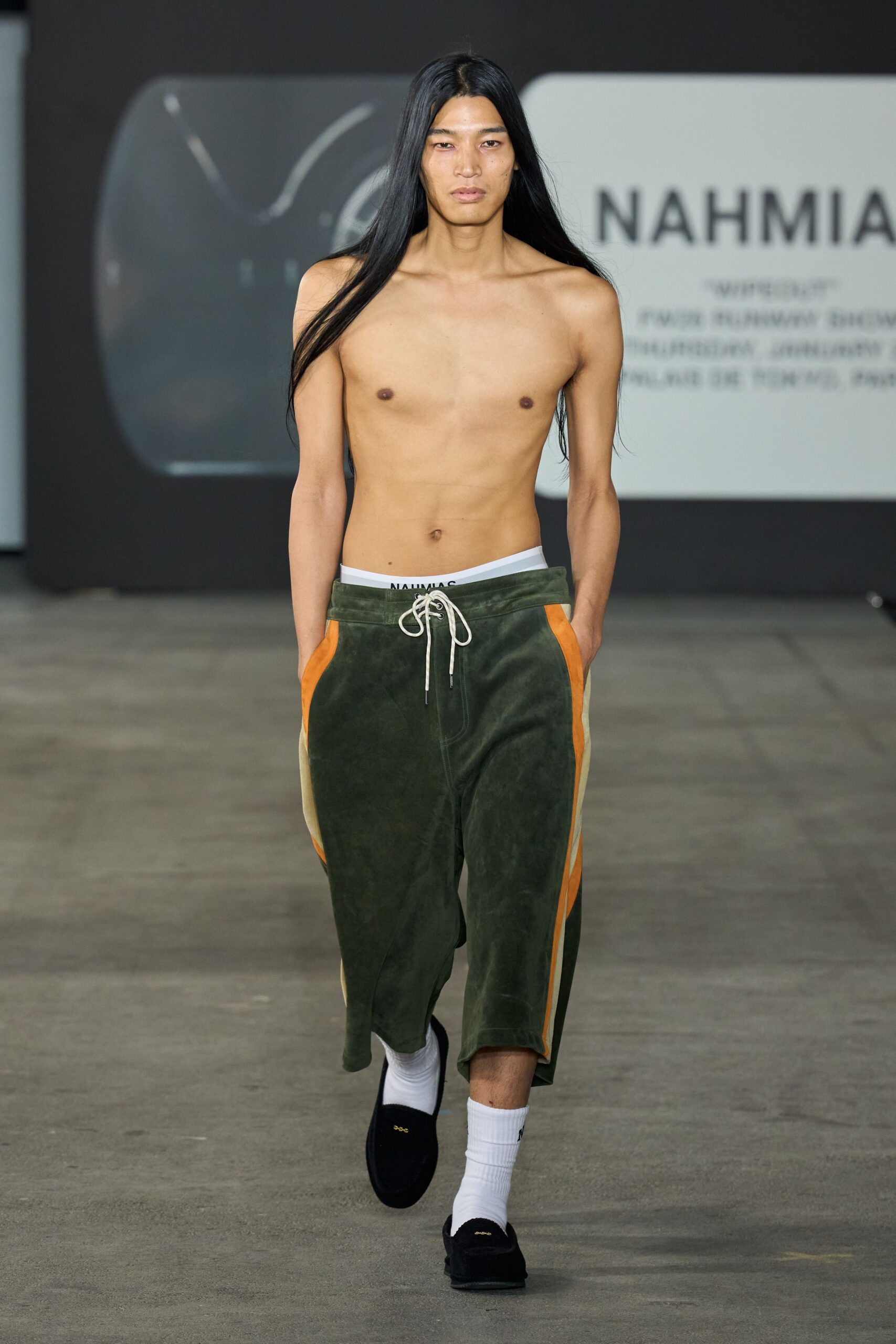 relaxed green pants with orange details