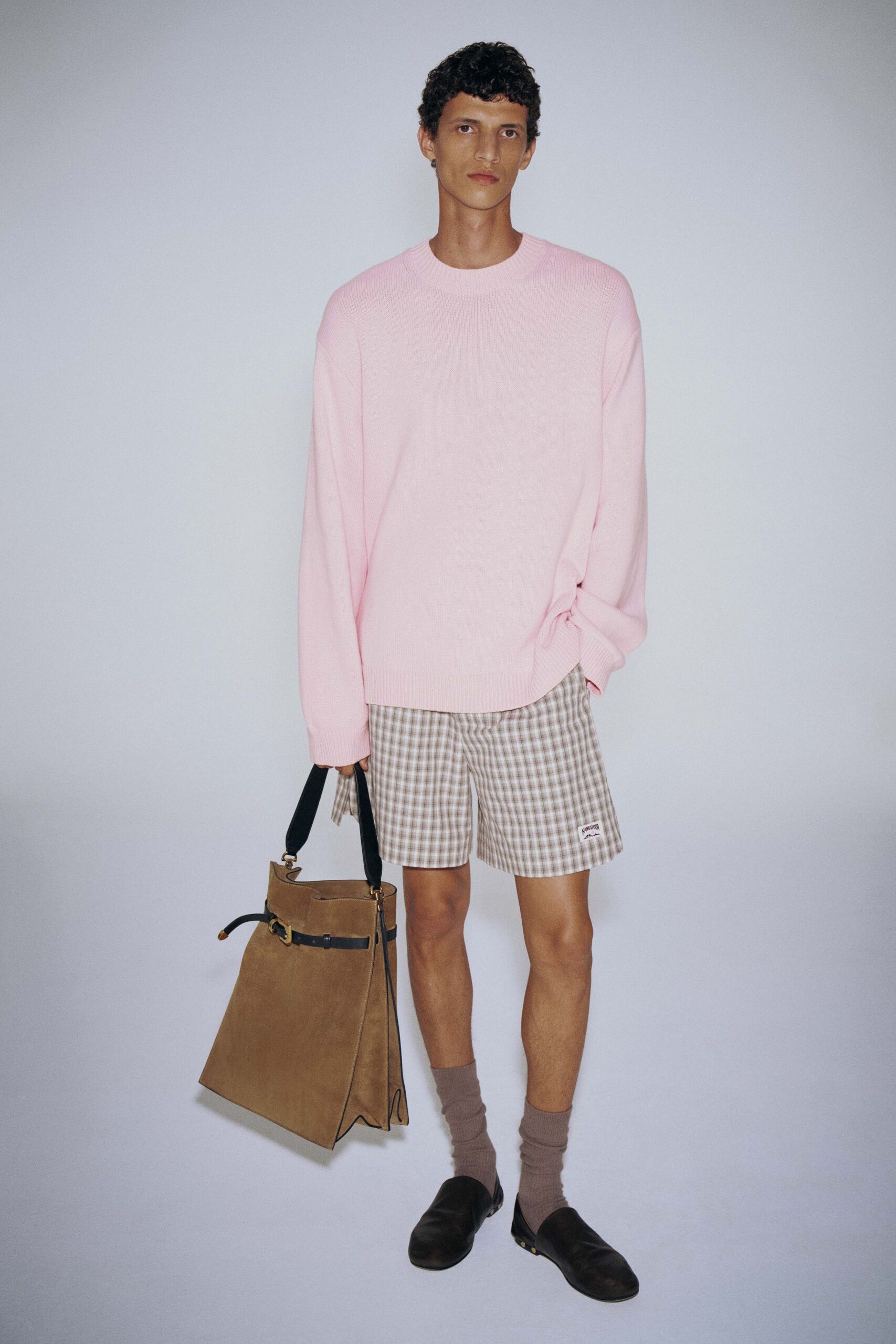 pink relaxed sweater with checked shorts