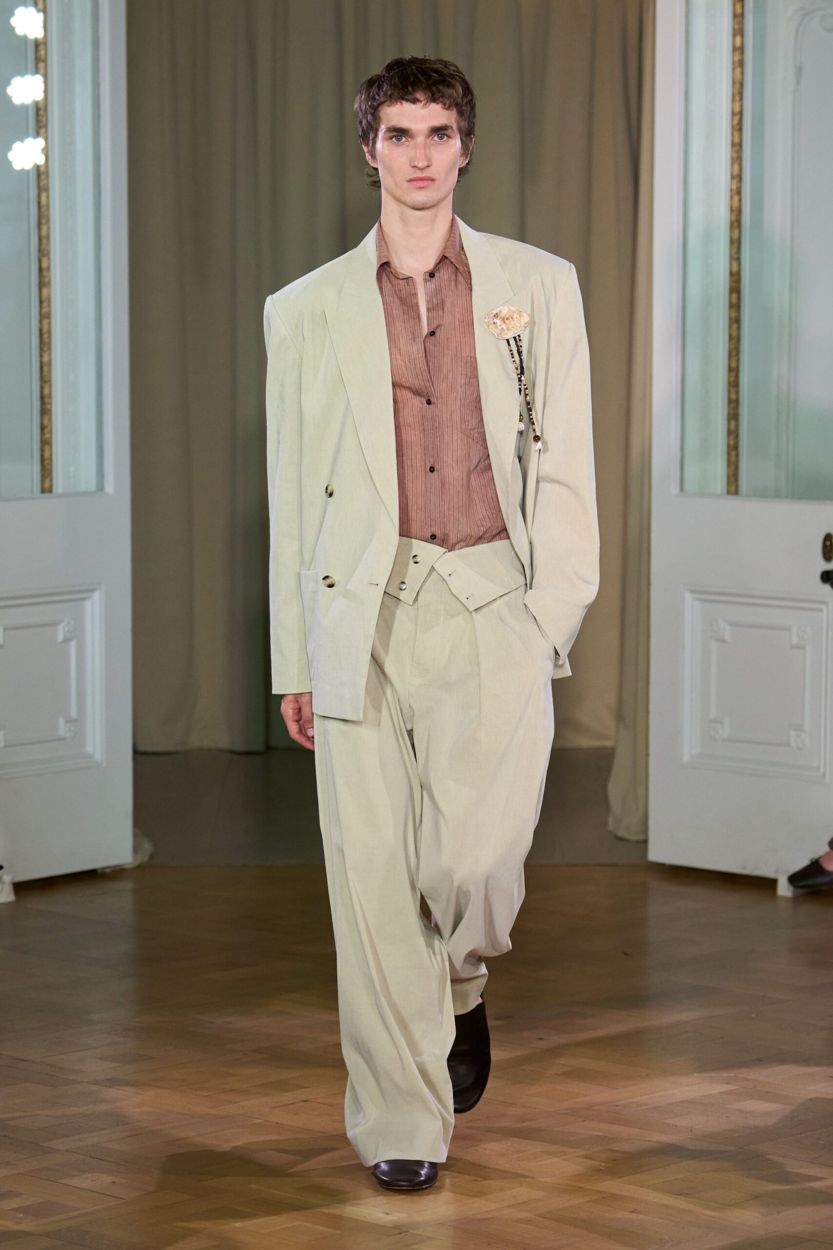 beige tailored suit with brown shirt