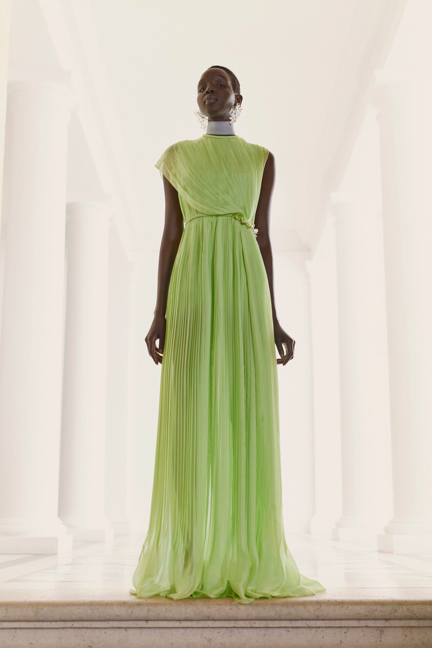 green pleated sleeveless gown
