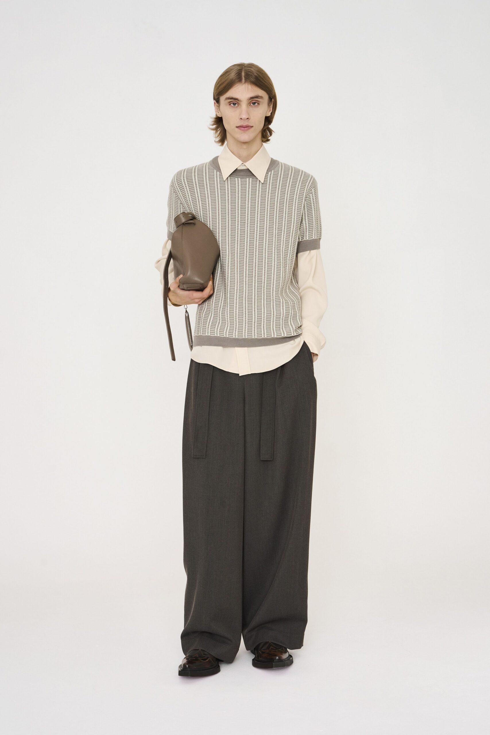 gray striped top with black pants