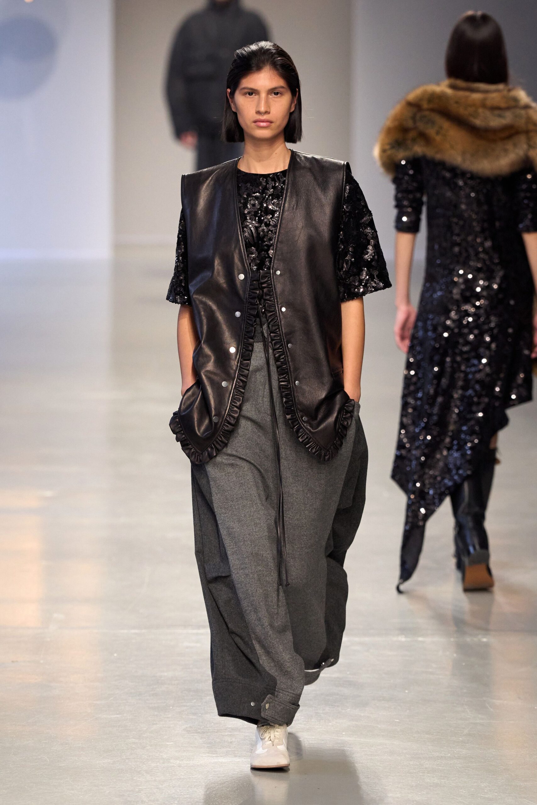 black leather vest with sequined top