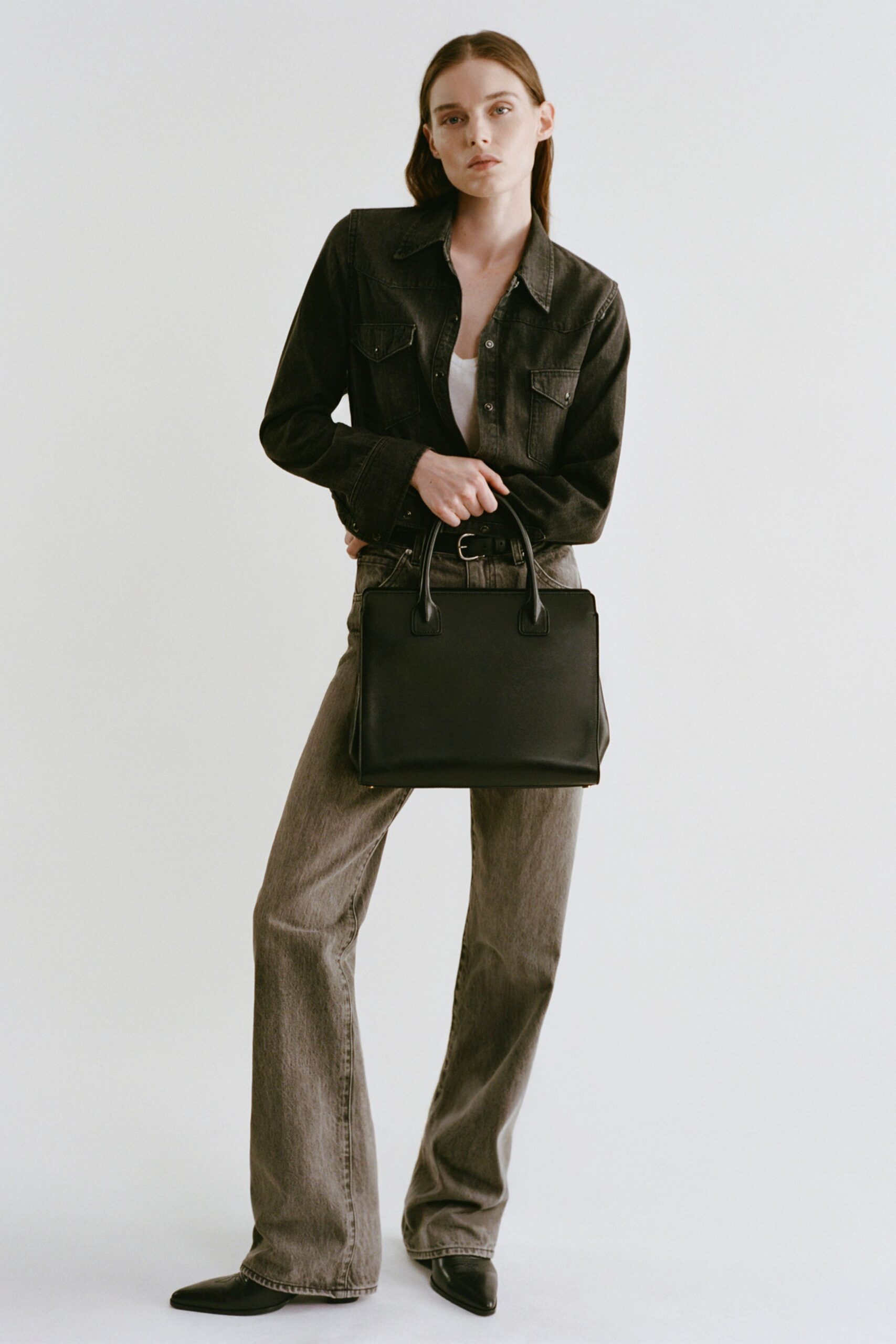 black denim jacket with gray pants