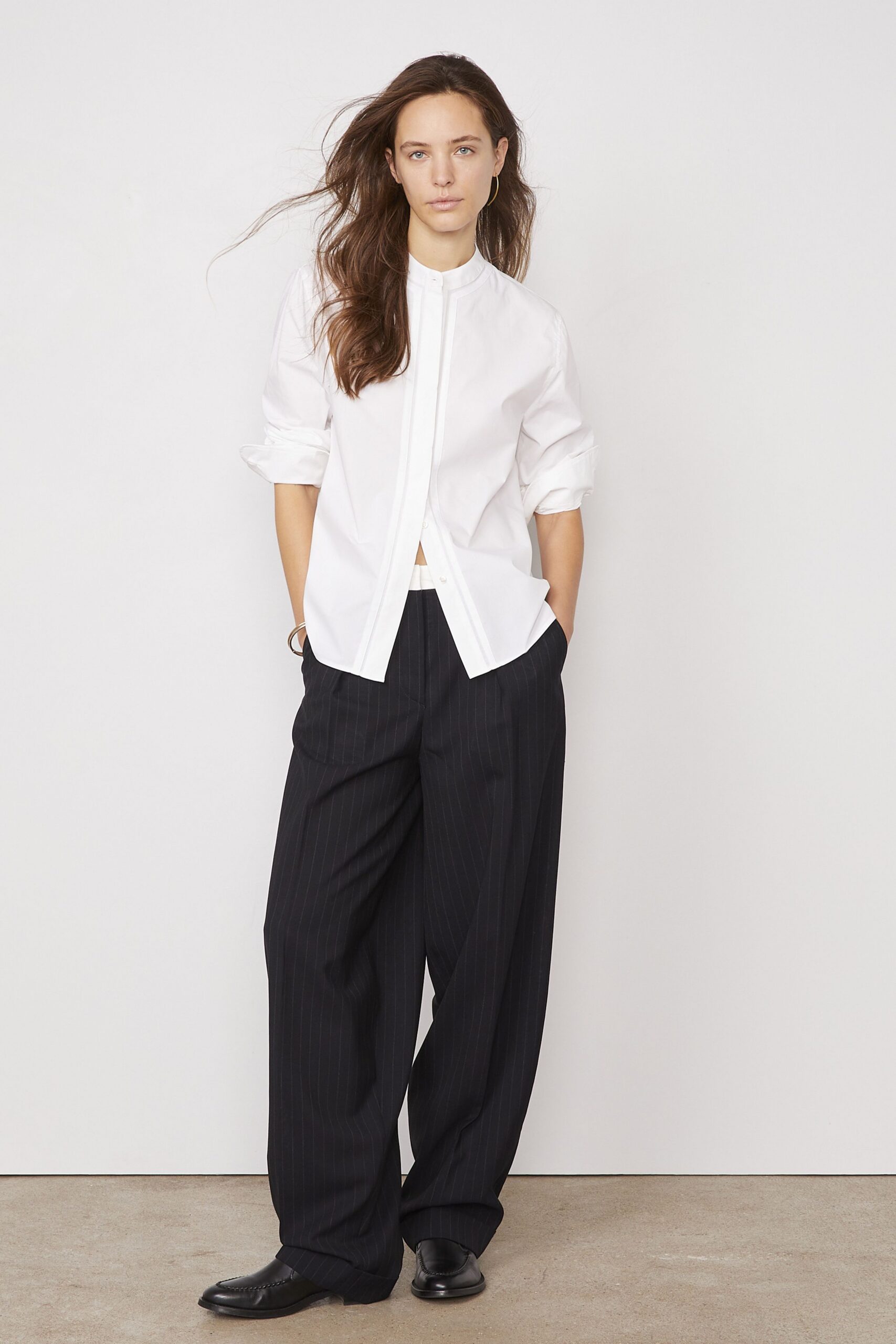 white relaxed shirt black pants