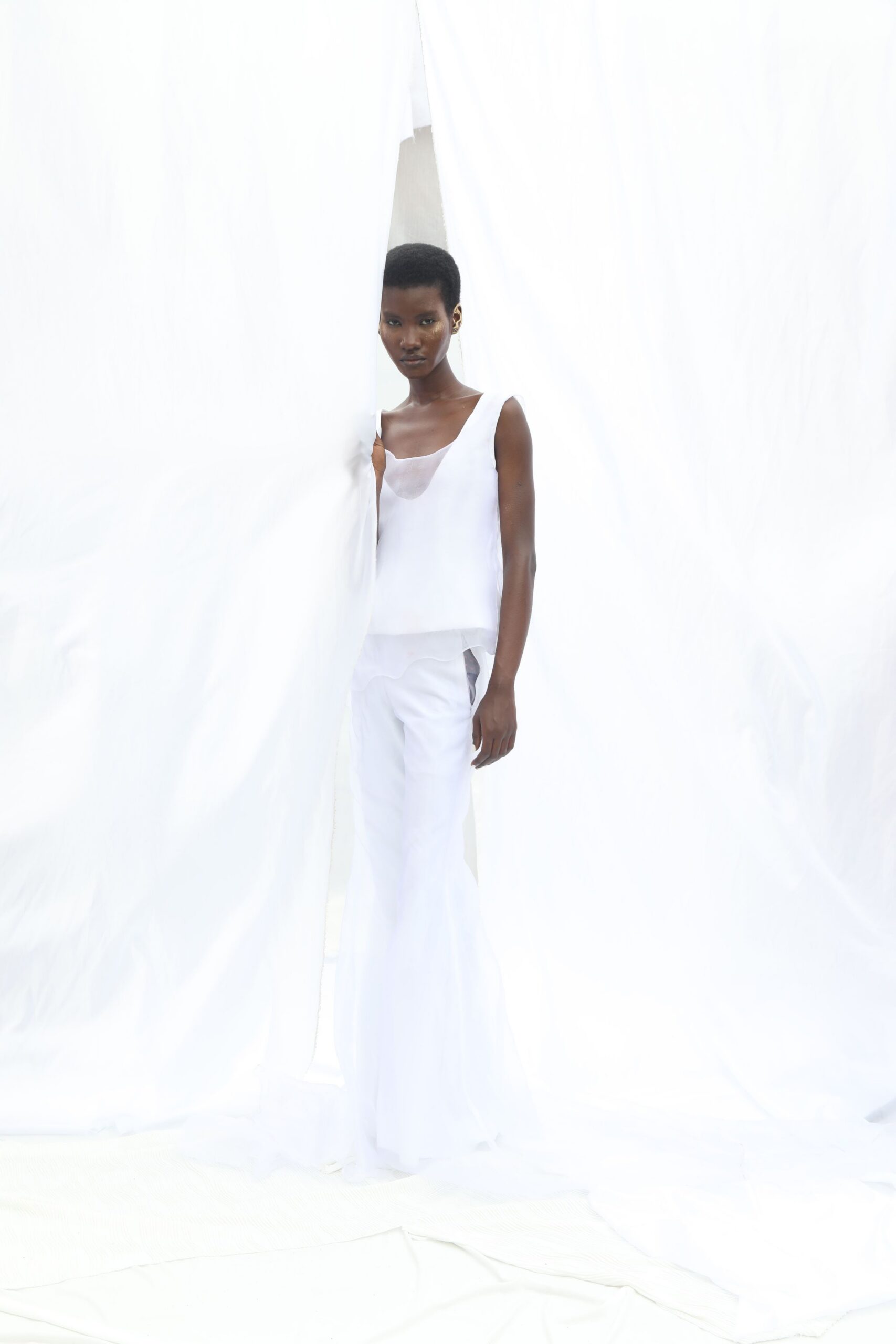 white silk long-sleeve fitted flared flowing pants