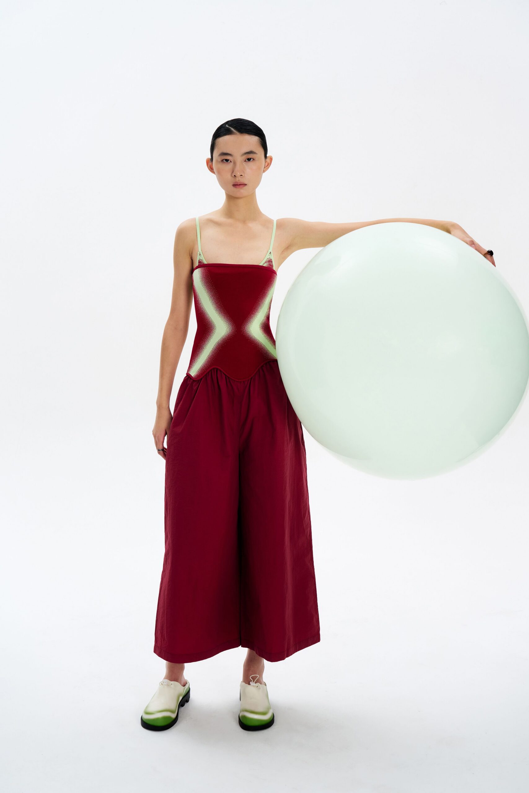 red cotton sleeveless square-neck relaxed pleated jumpsuit