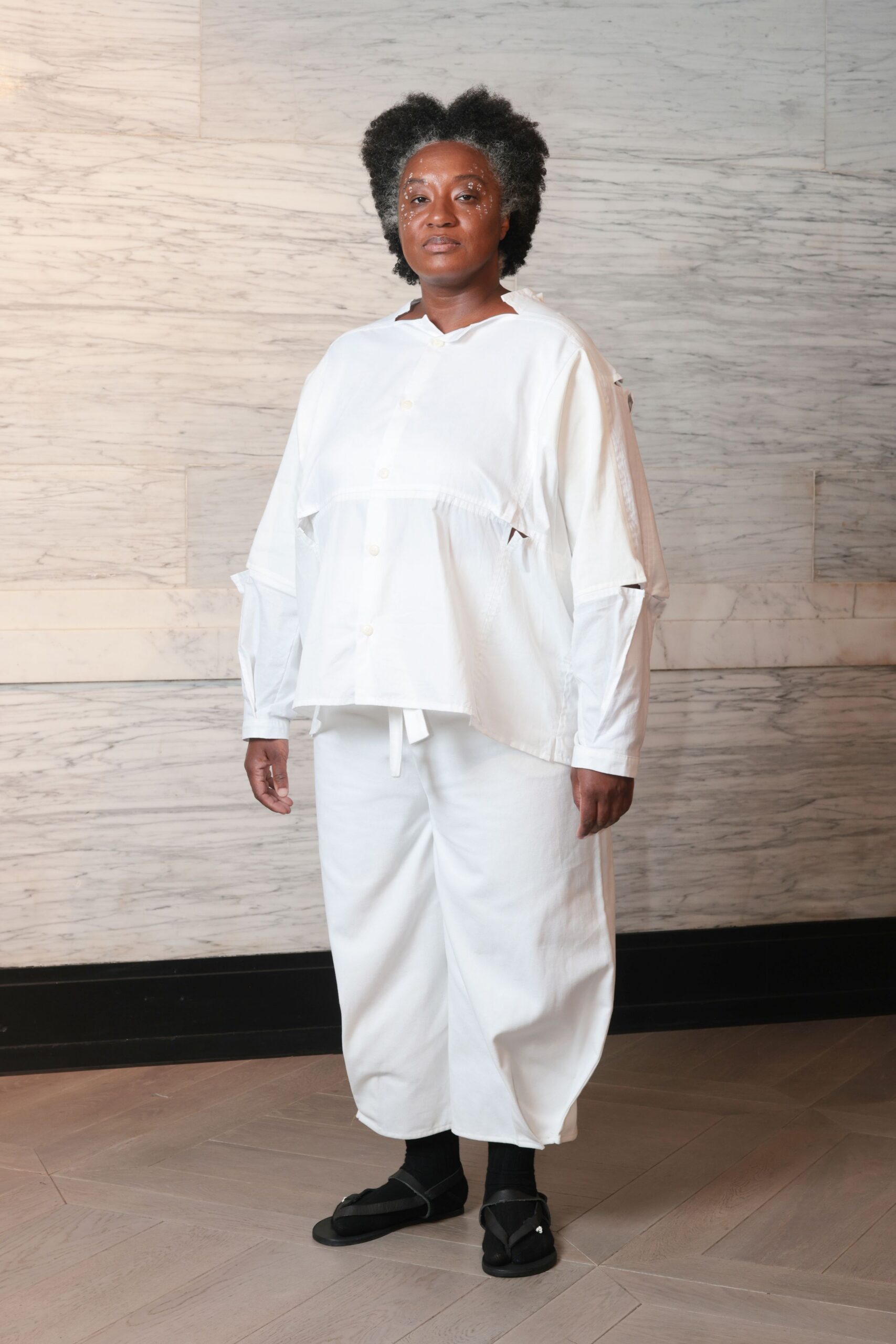 white relaxed shirt and pants