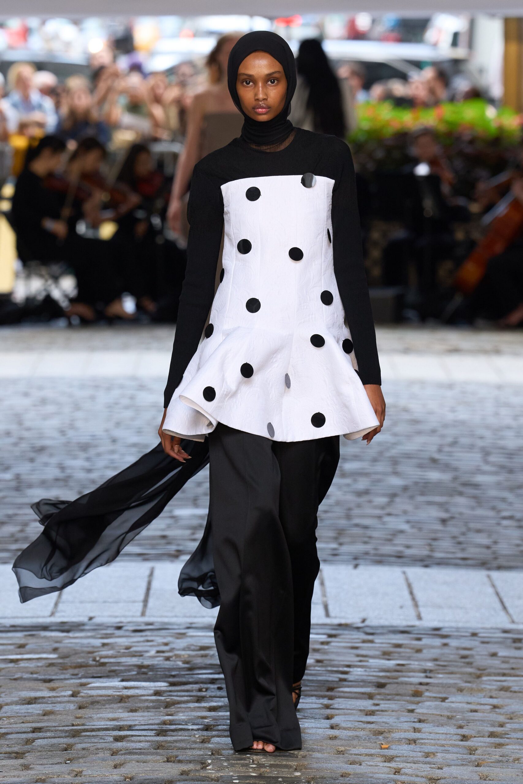 black and white polka-dot top with pants