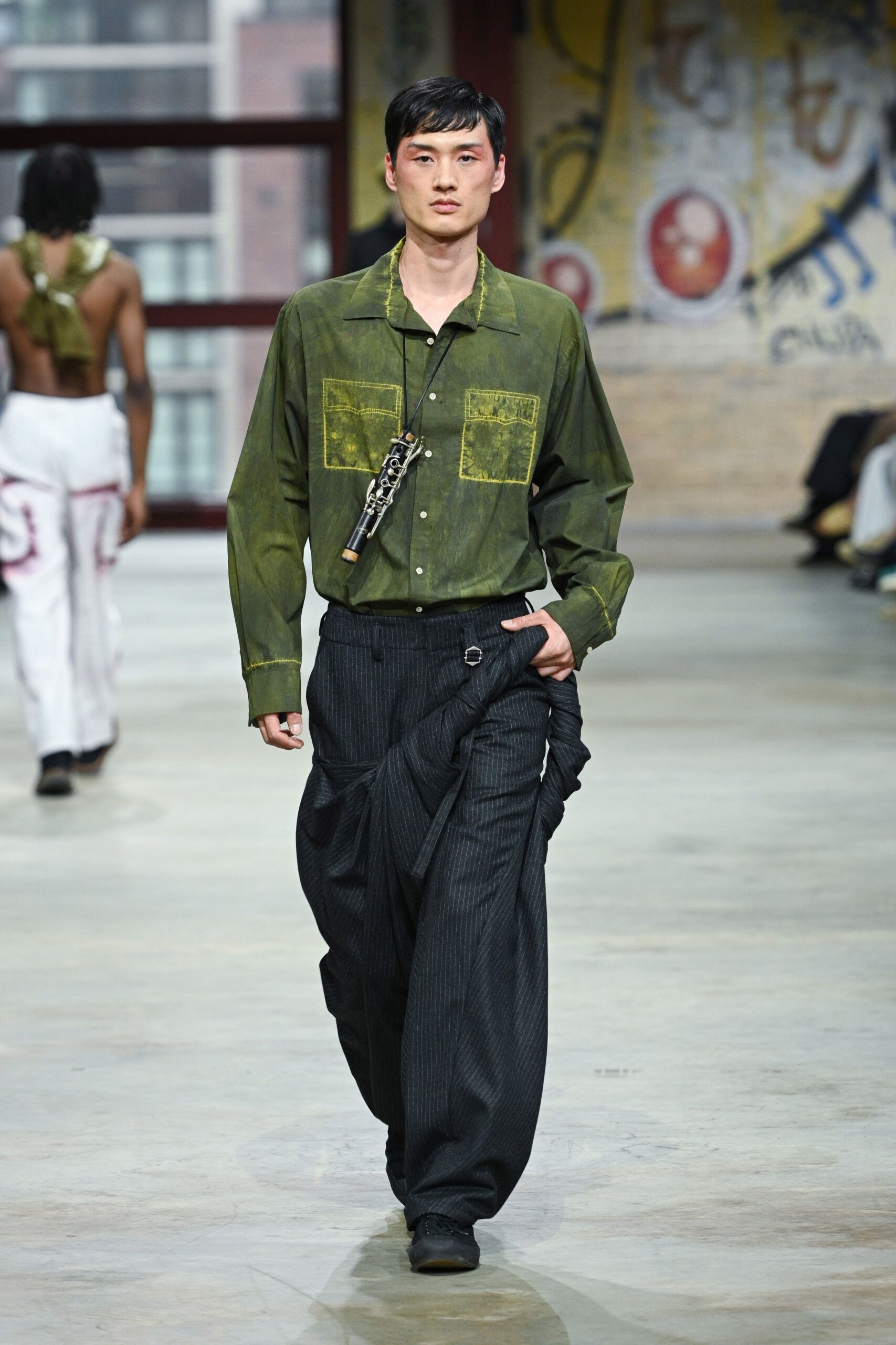 green relaxed shirt with black pants