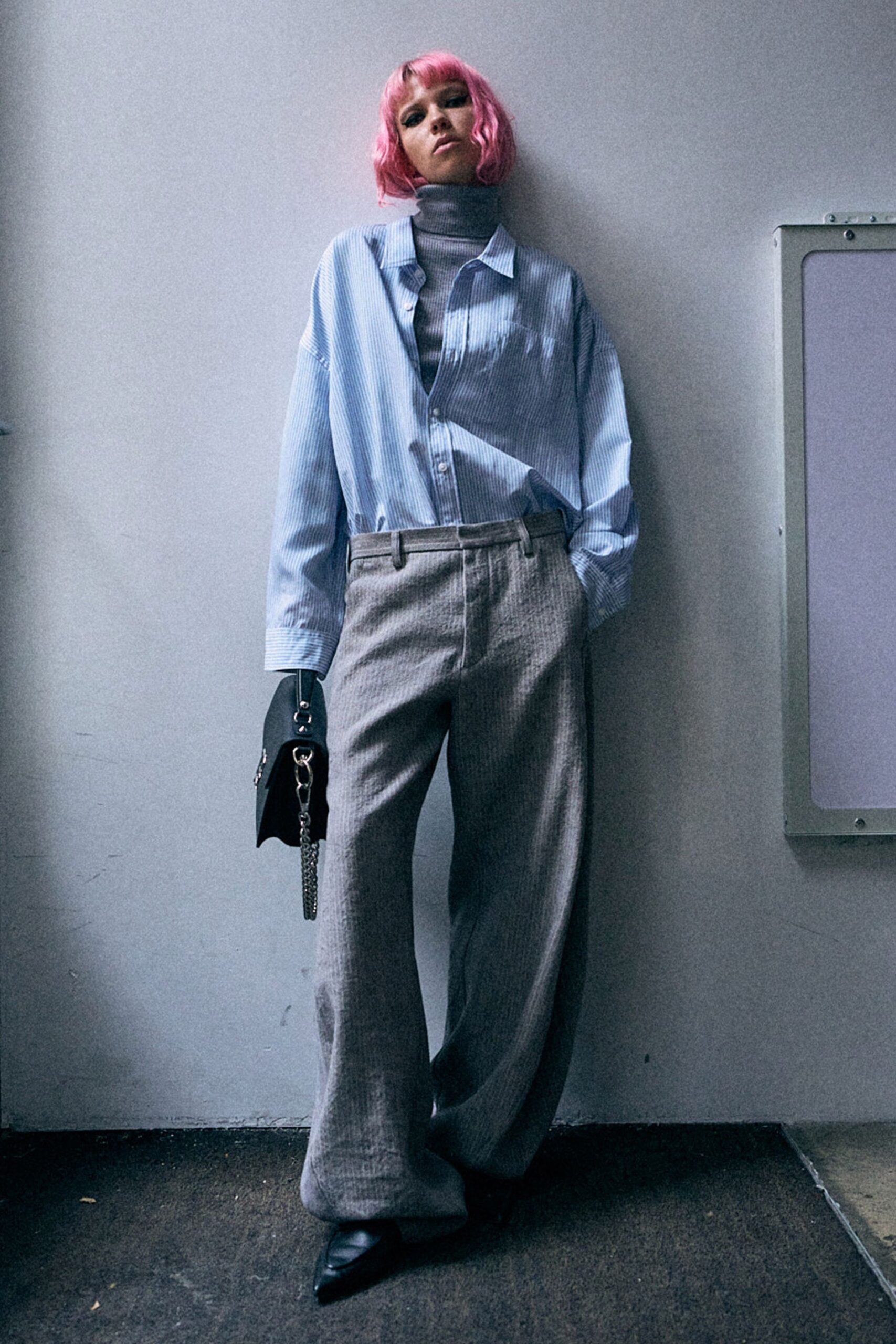 blue striped shirt with gray pants