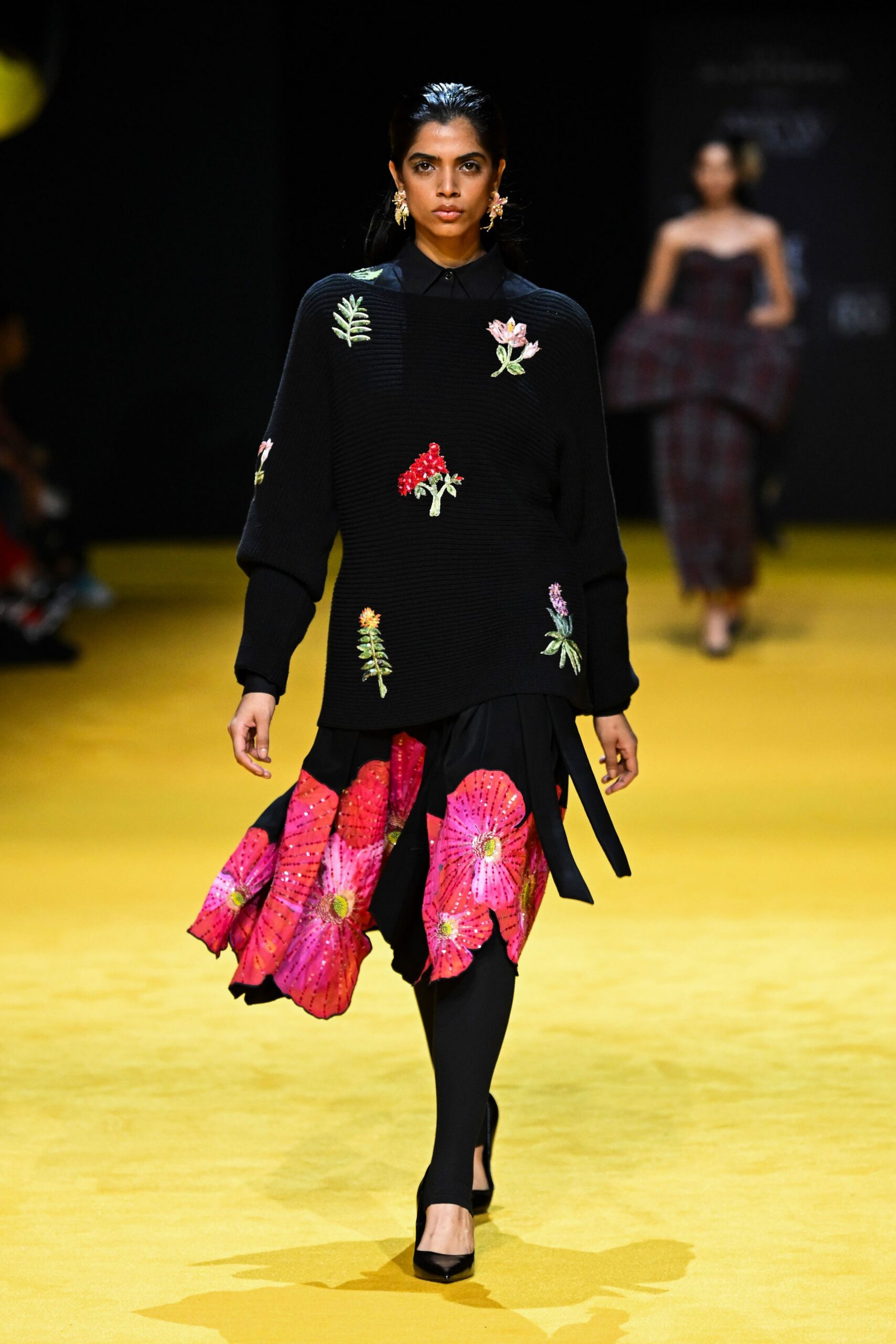 black embroidered top with pink skirt