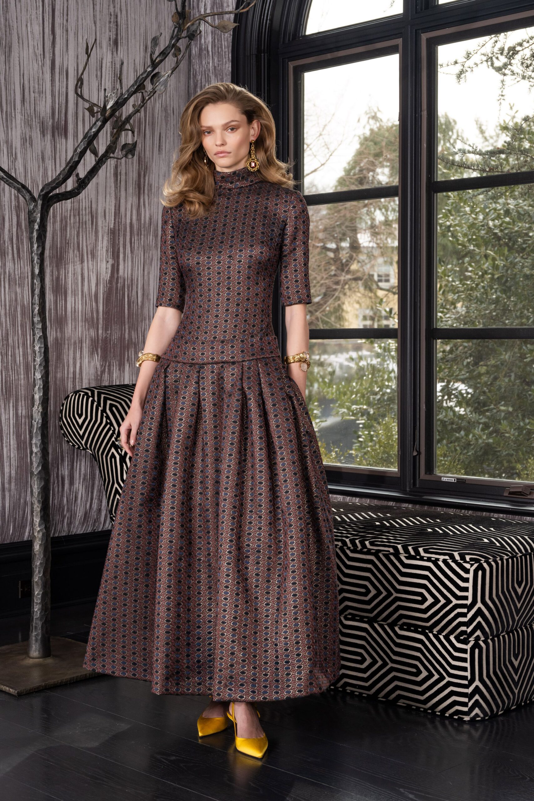 brown silk pleated gown with yellow heels