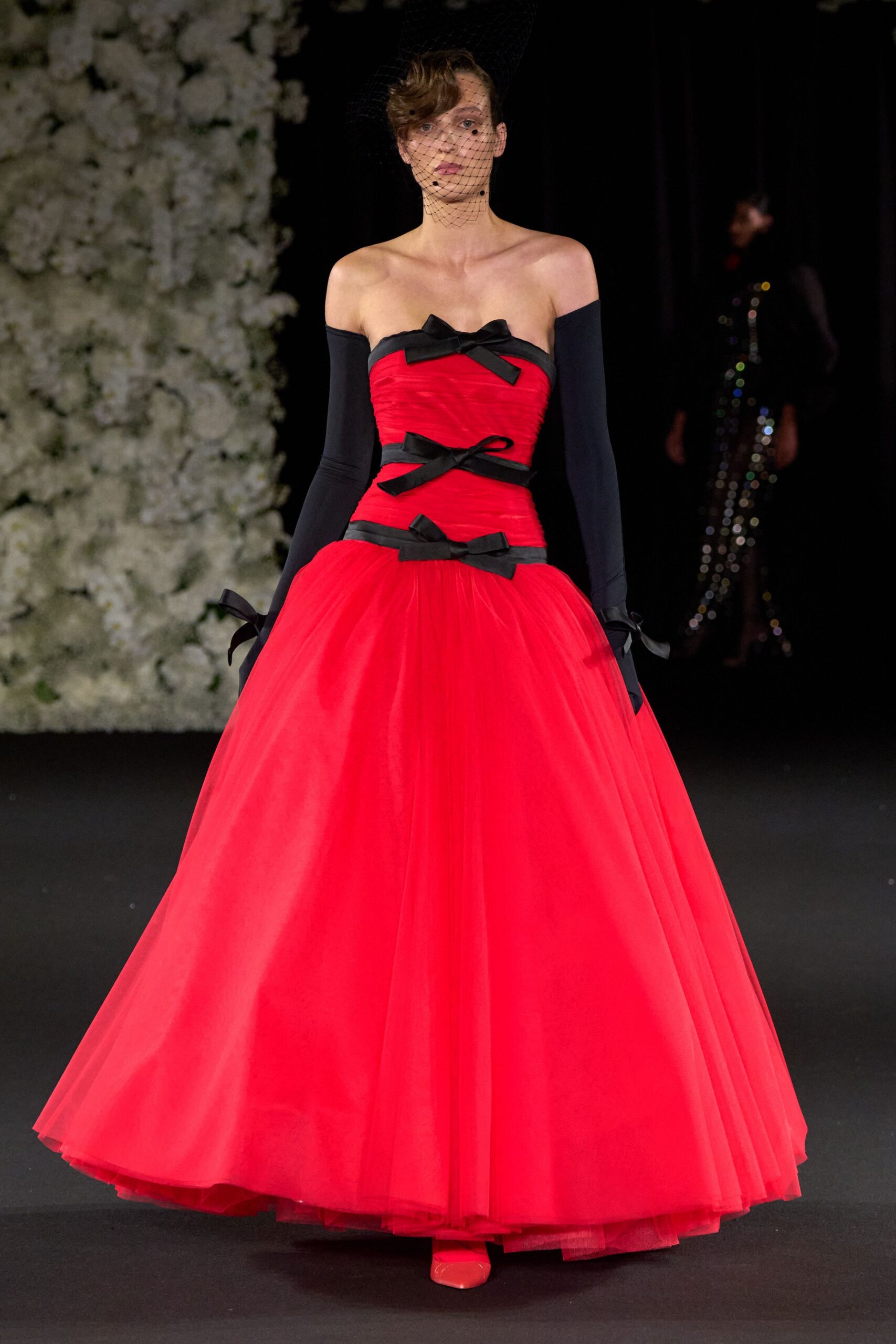 red tulle strapless fitted pleated layered flowing gown