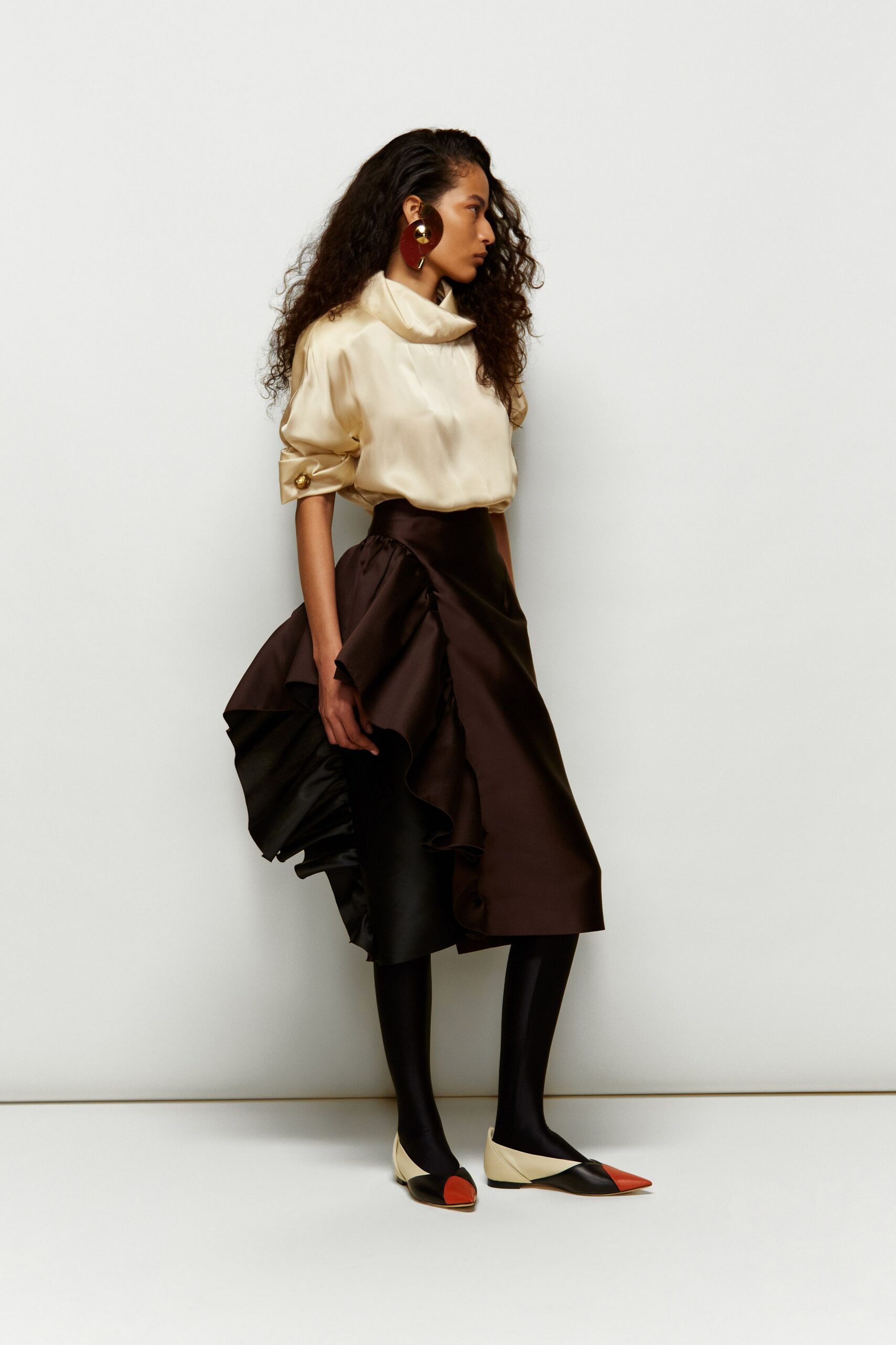 beige silk long-sleeve collared fitted draped blouse