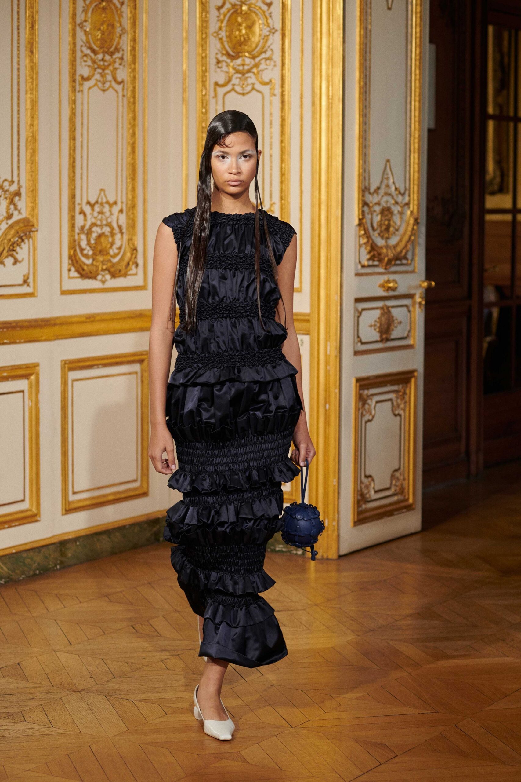 black ruffled maxi dress with white shoes