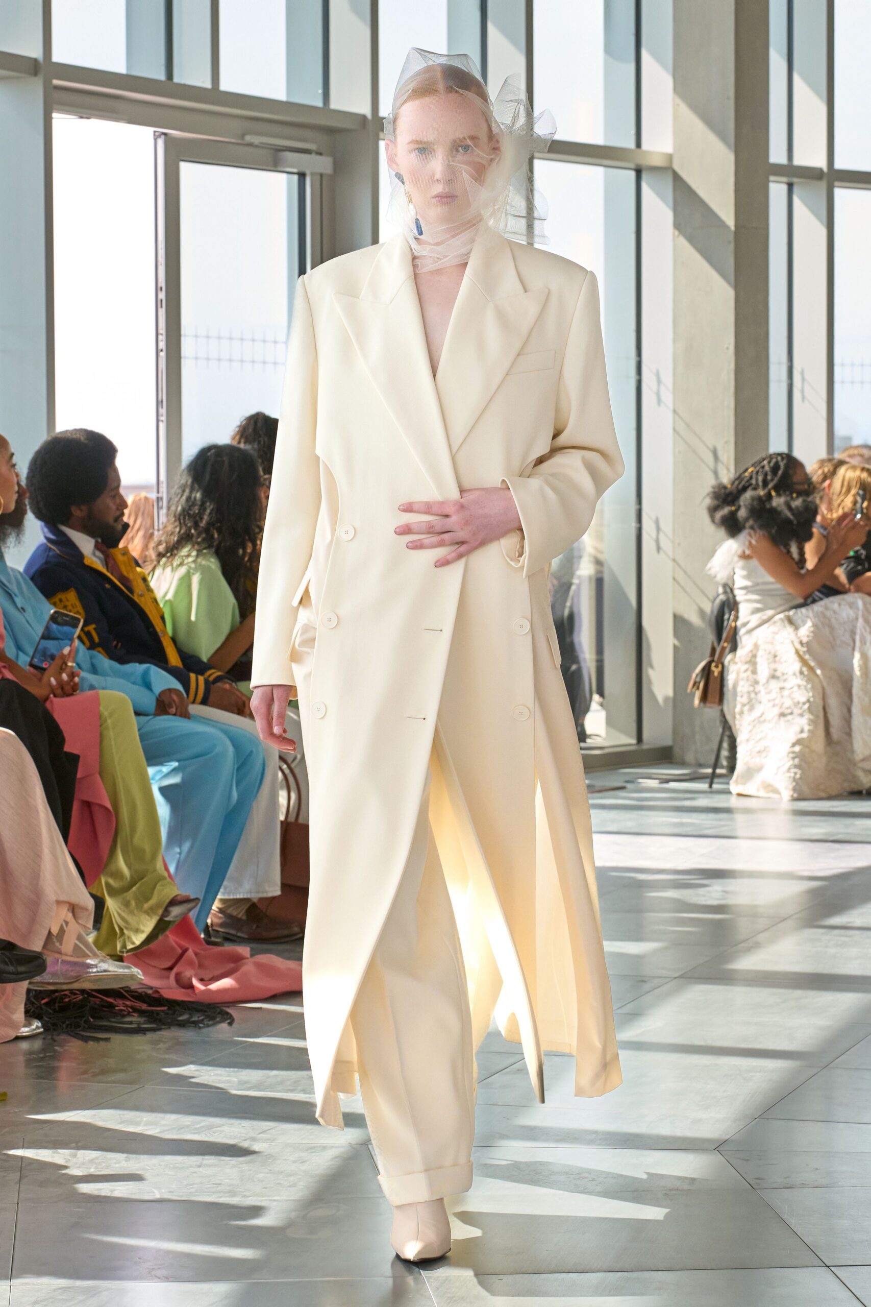 white tailored coat and pants
