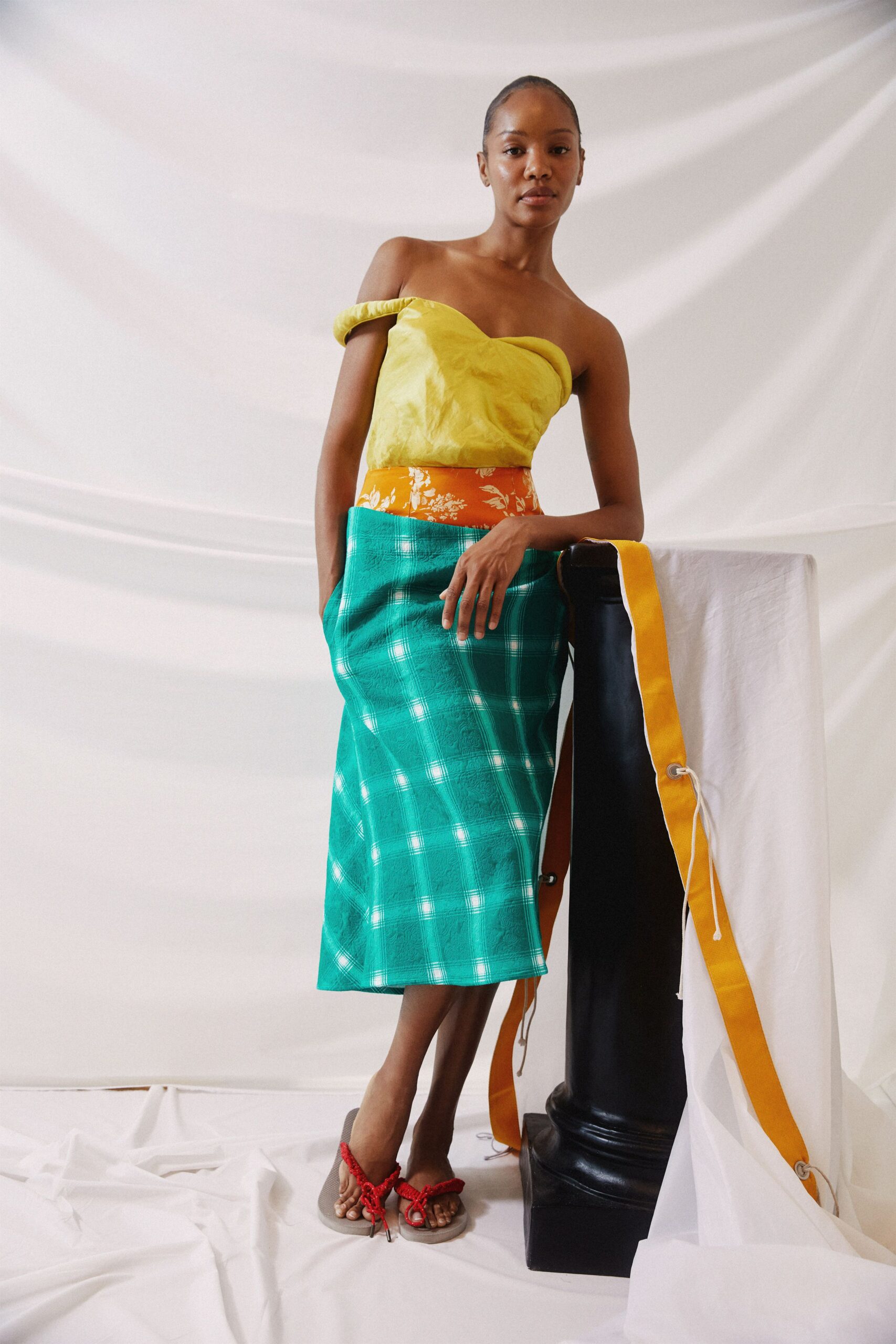 yellow off-shoulder top with green midi skirt