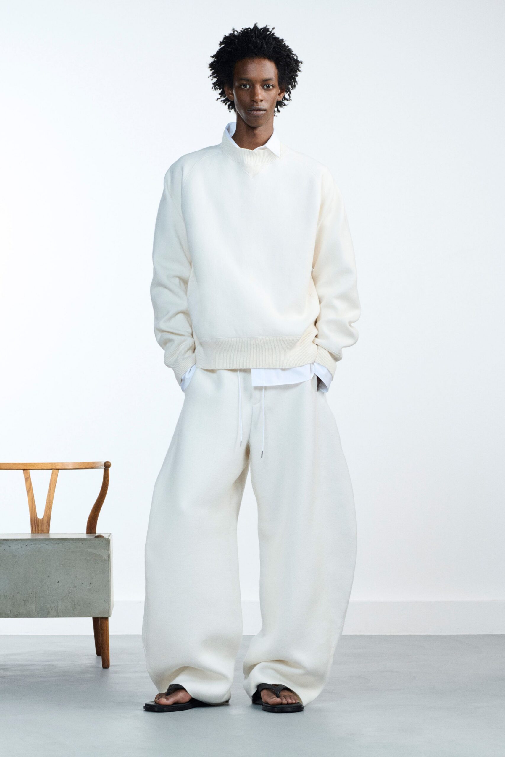 white oversized sweater and relaxed pants