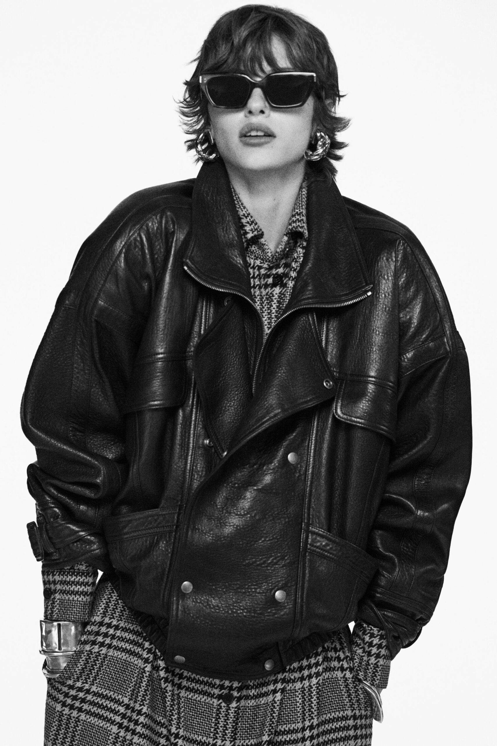 oversized black leather jacket with checked blouse