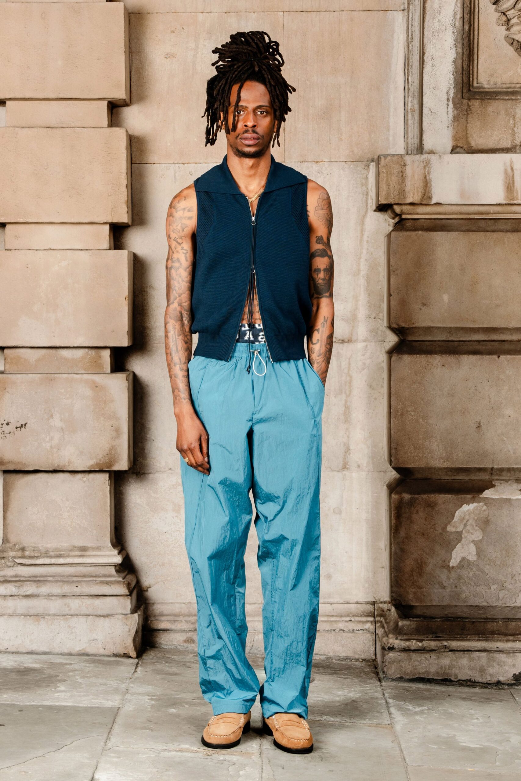 blue cotton sleeveless collared fitted vest