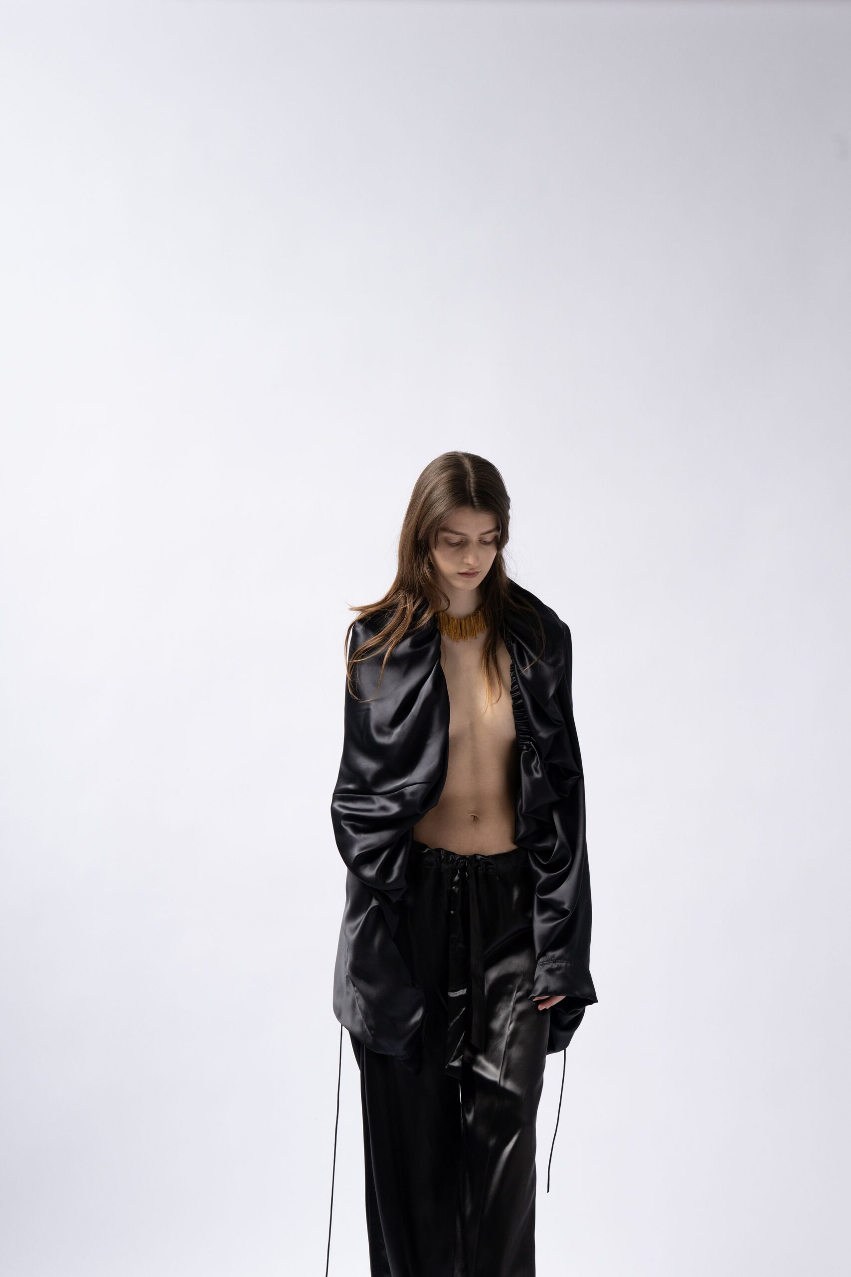 black silk long-sleeve collared relaxed buttoned shiny jacket