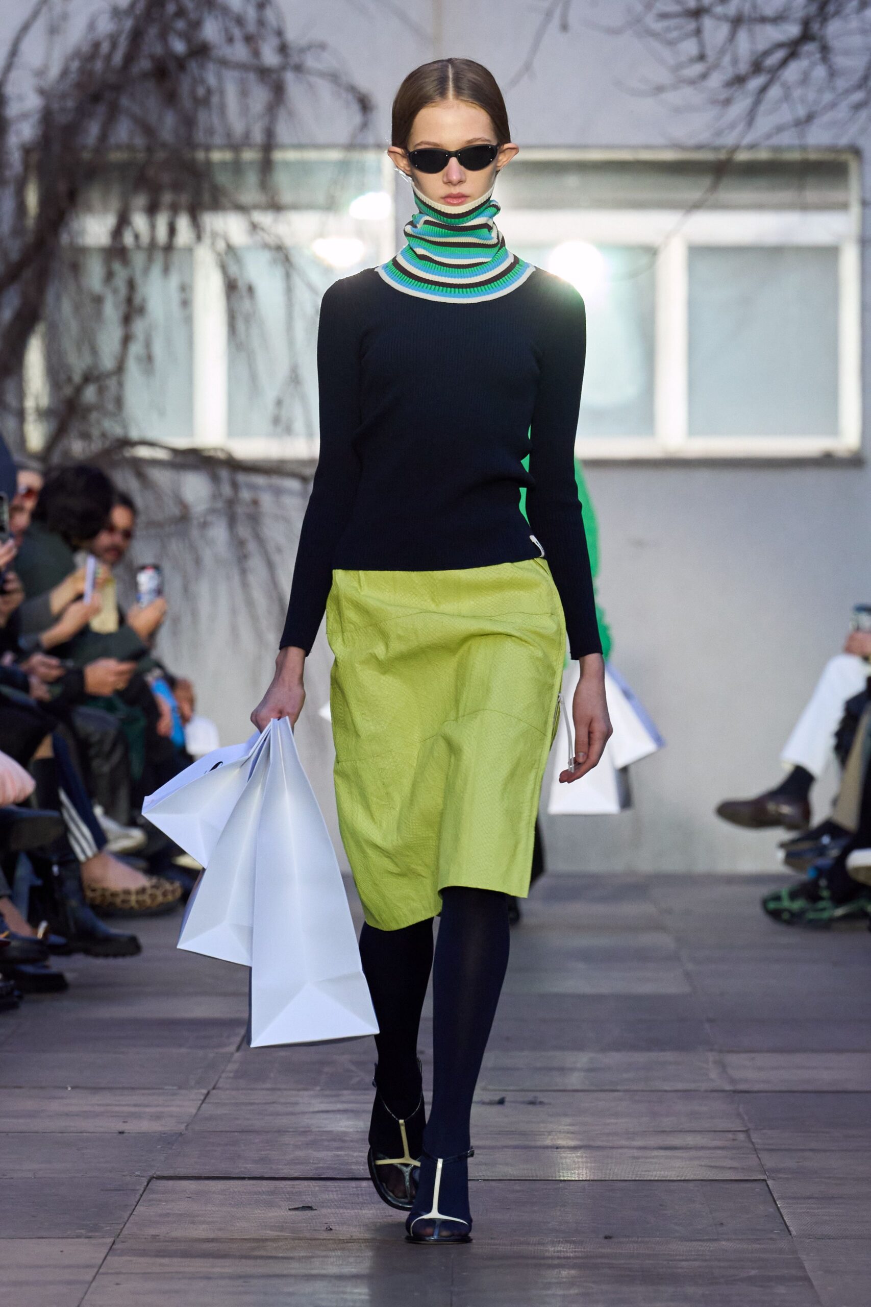 black knit fitted top with yellow skirt