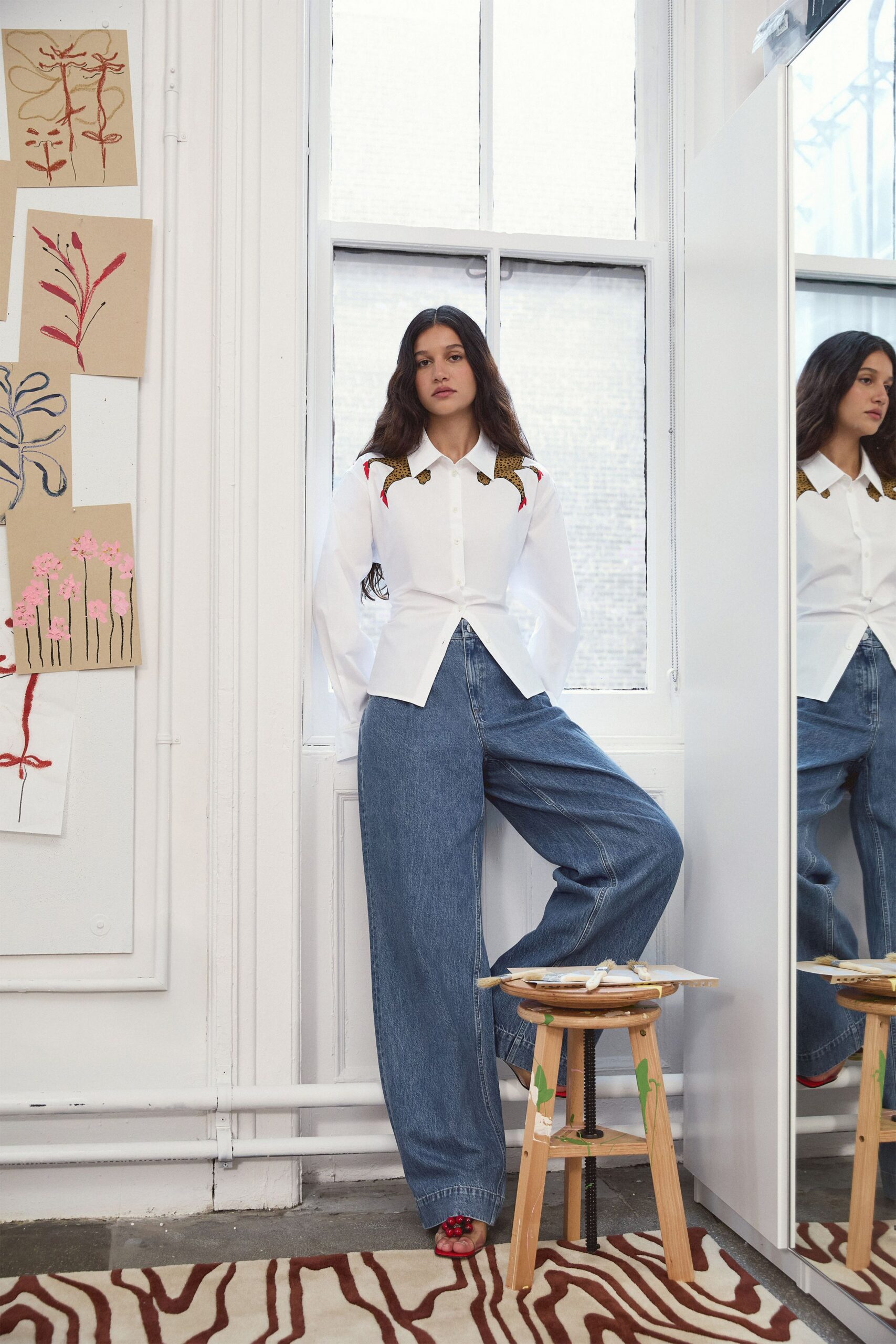 white shirt blue wide-leg pants