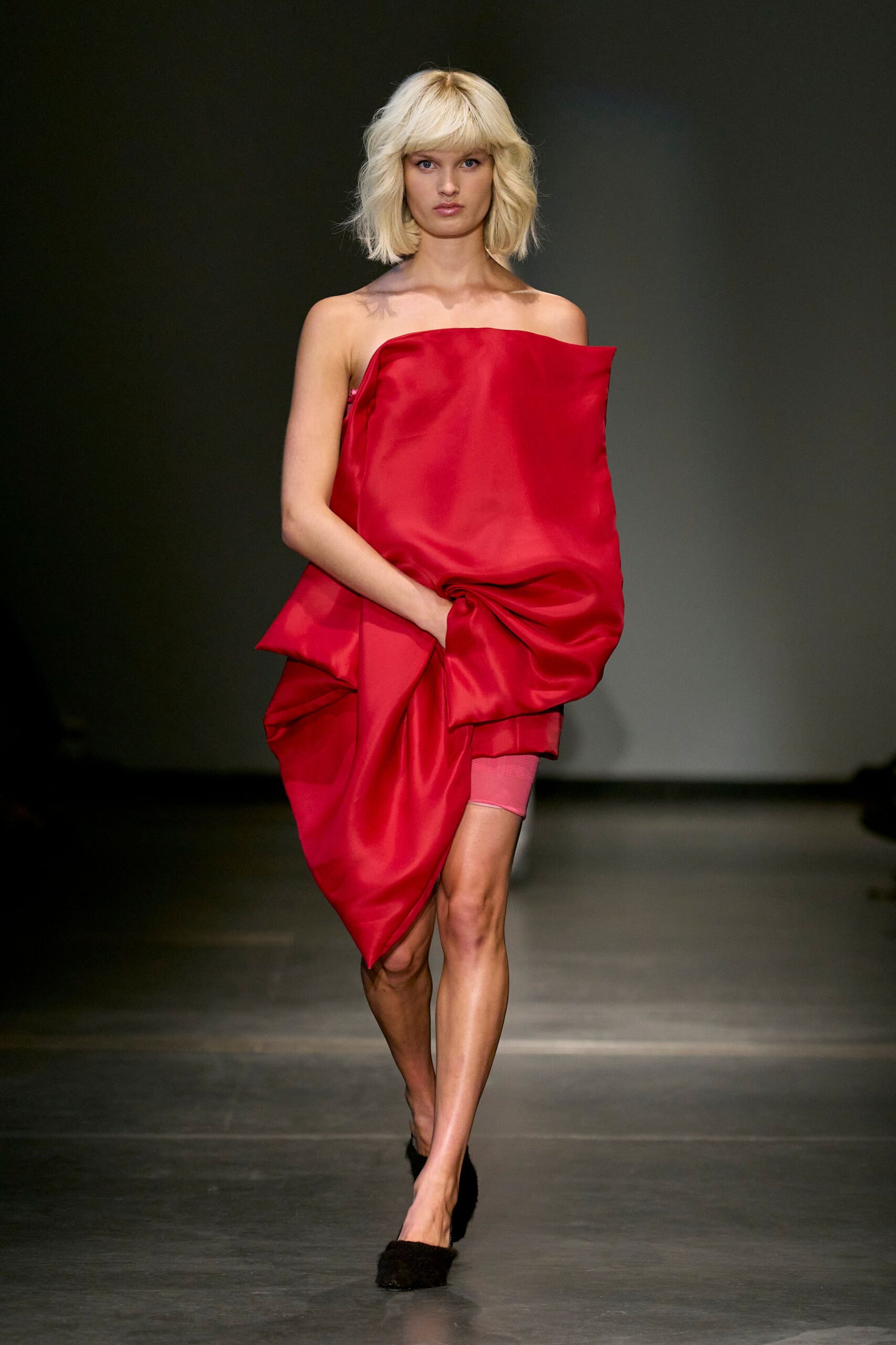 red silk strapless fitted draped dress