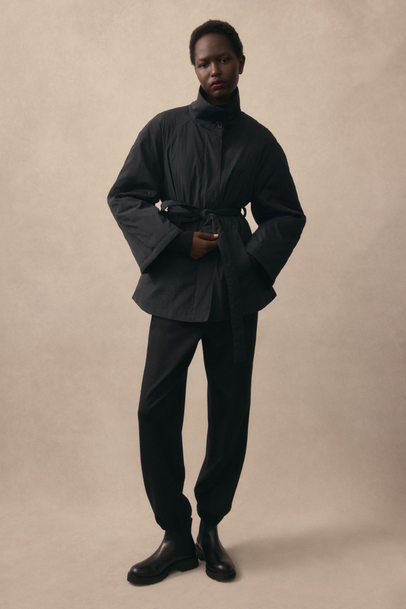black cotton long-sleeve collared relaxed belted jacket