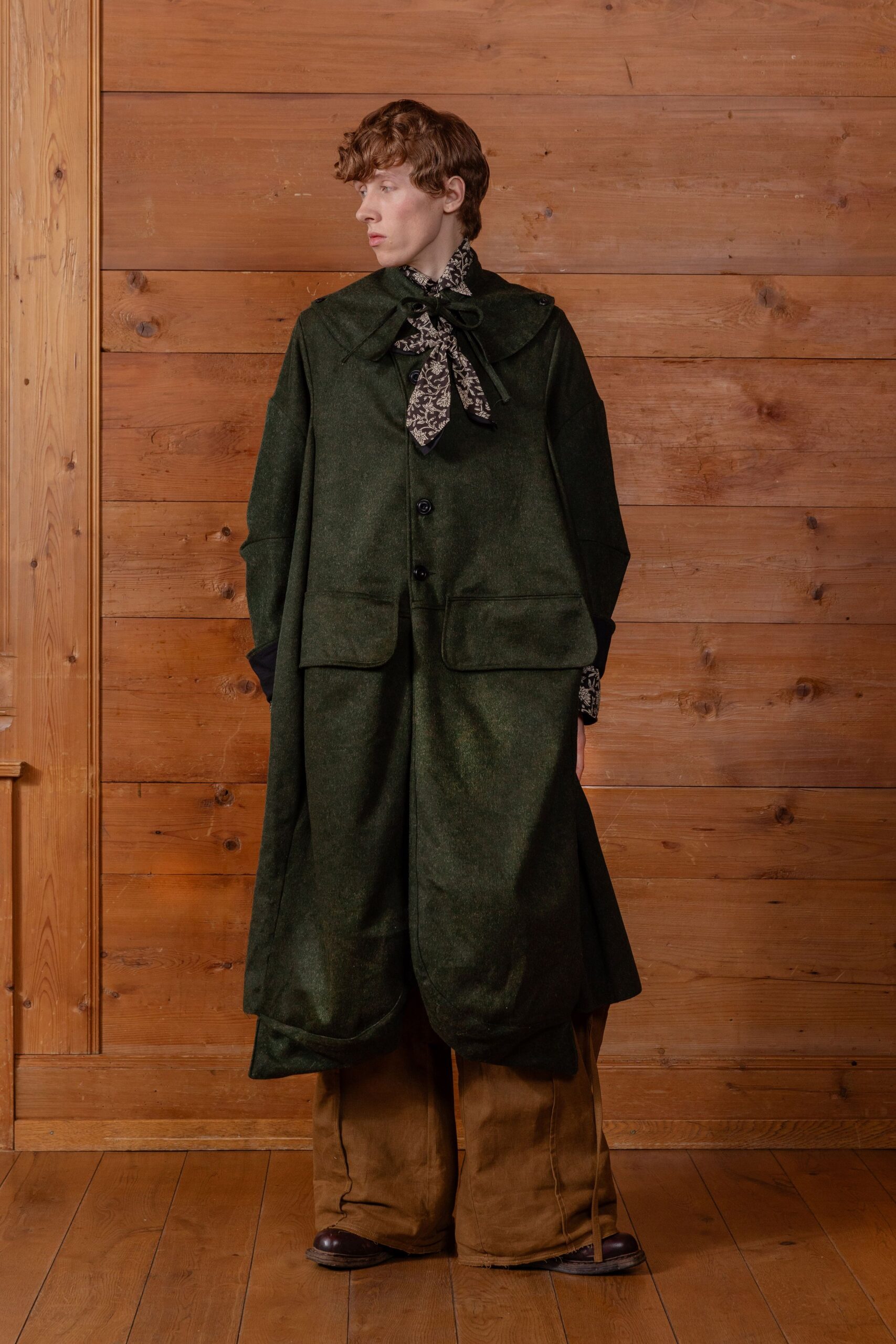 green wool cape with printed shirt
