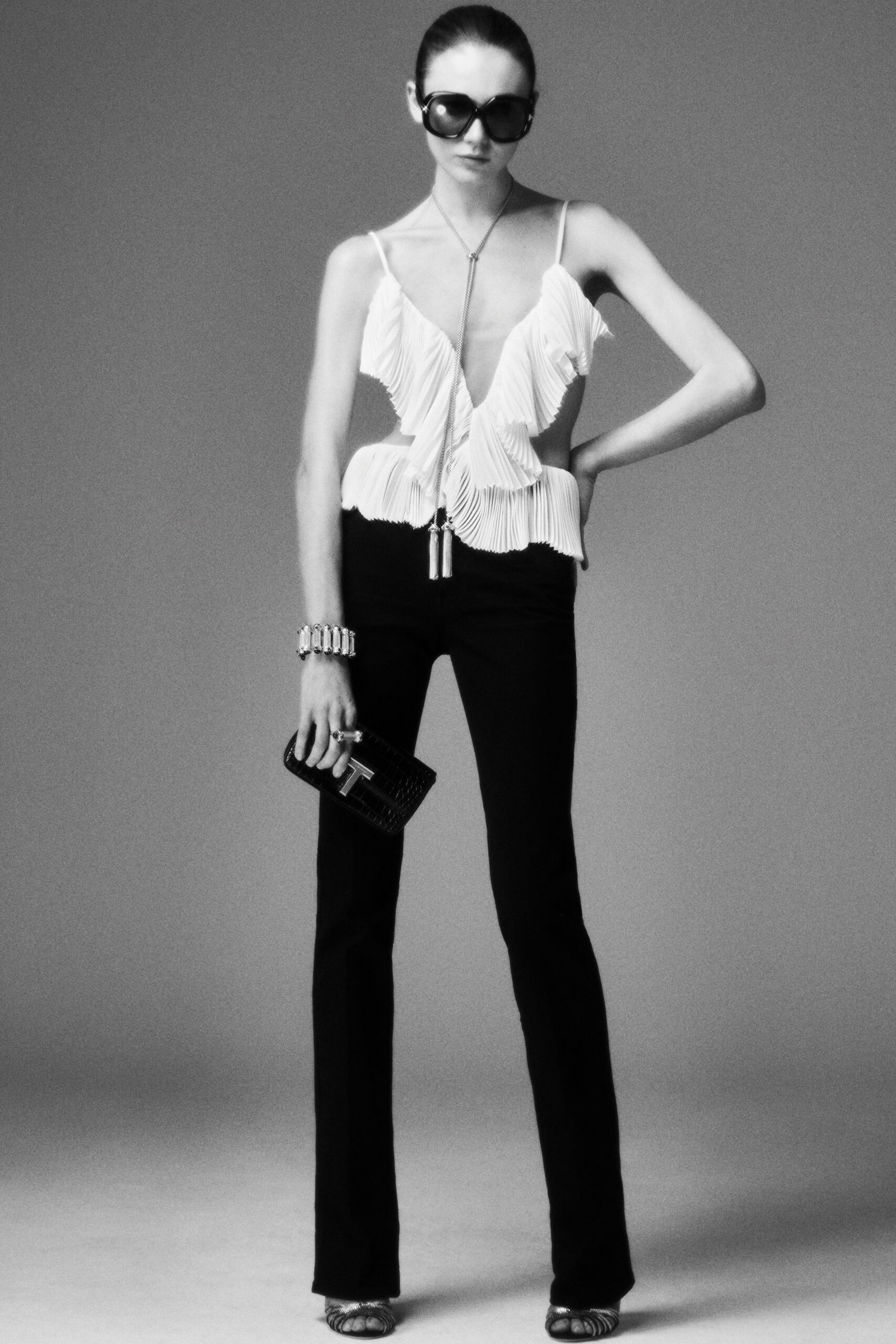 white pleated top with black pants
