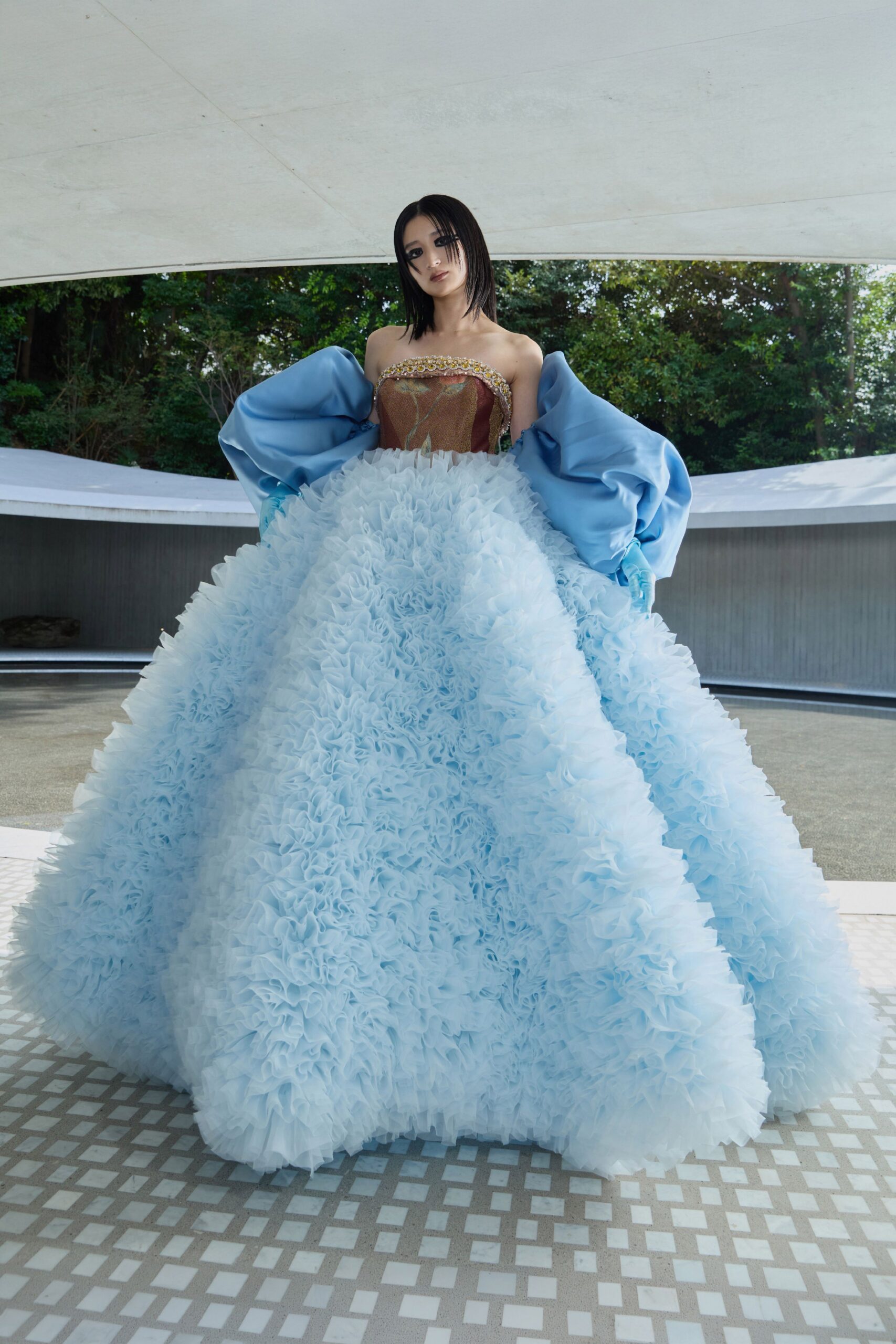 blue tulle sleeveless fitted ruffled layered flowing gown
