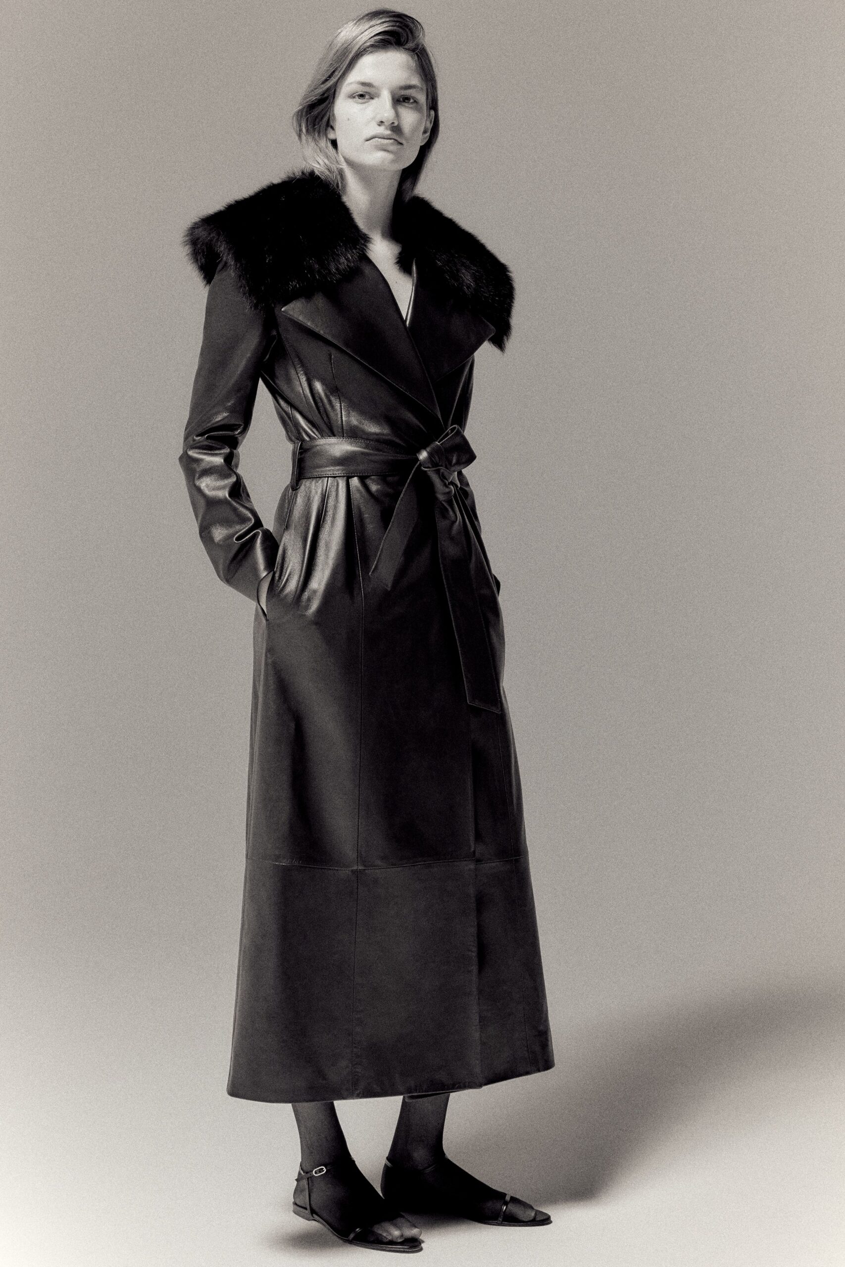 black leather long-sleeve collared fitted belted maxi coat