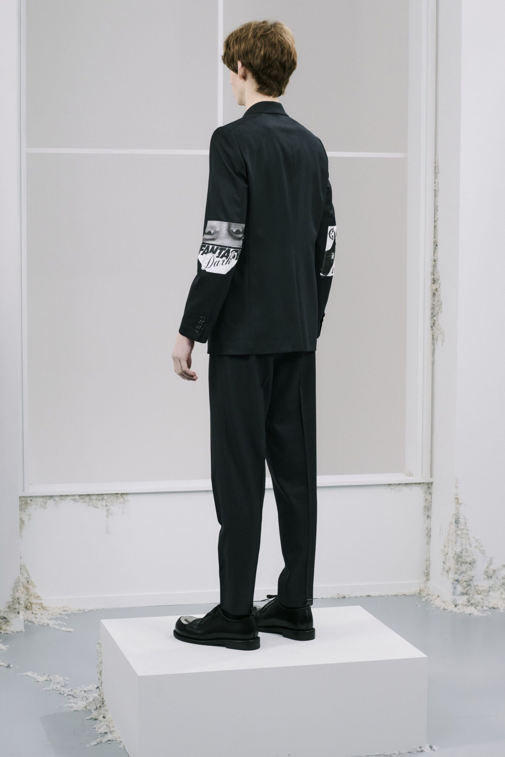 black tailored blazer with relaxed pants