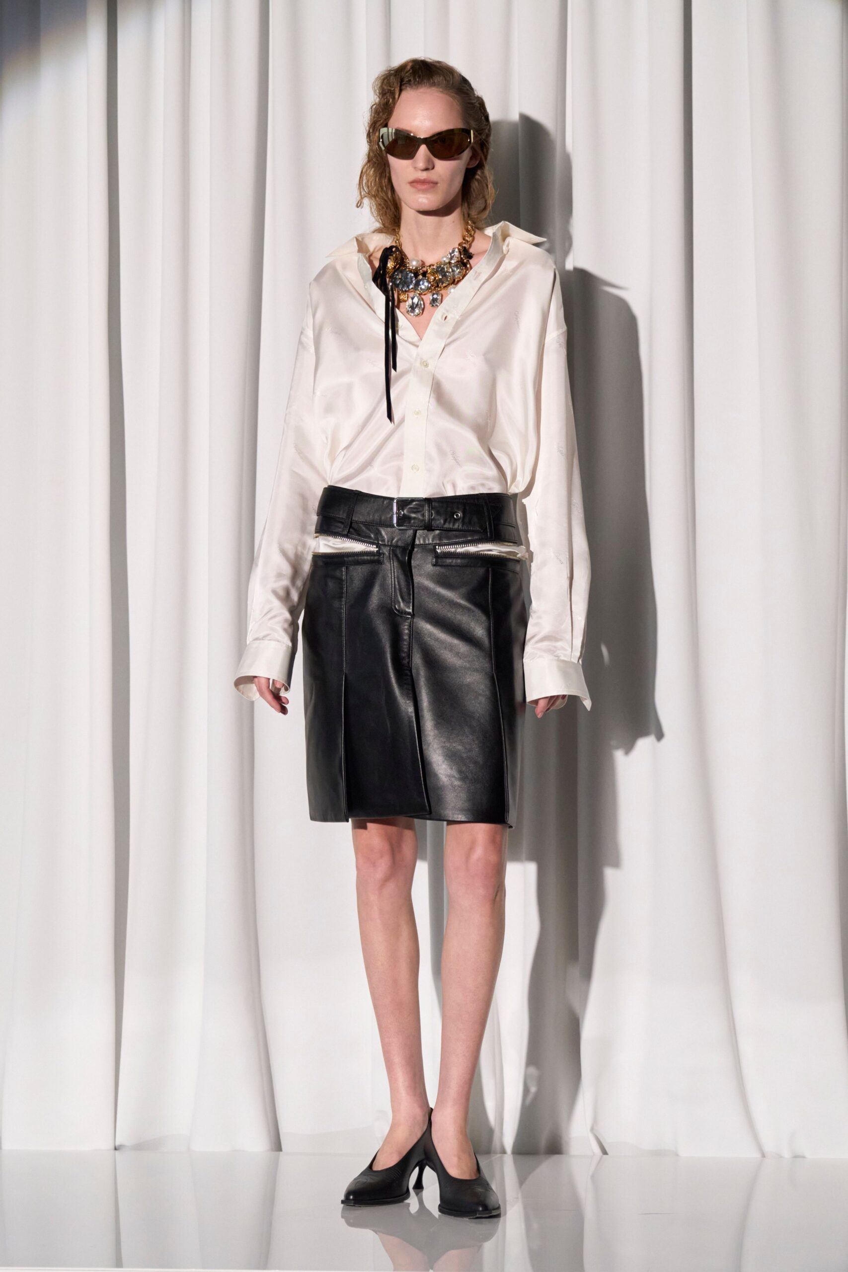 white silk shirt black leather skirt