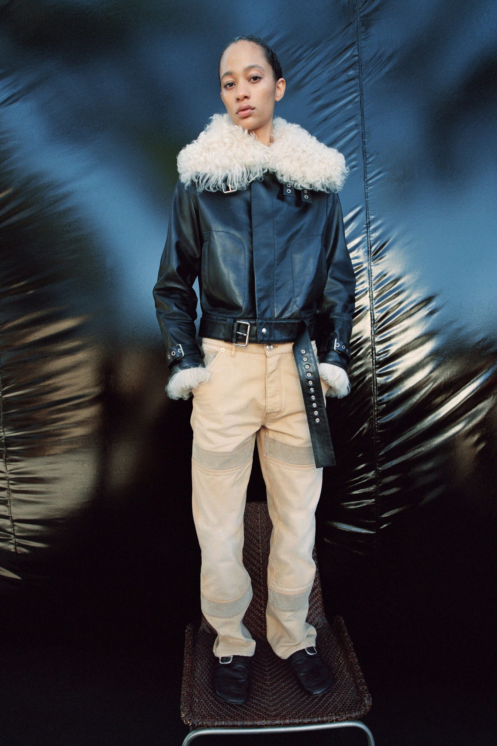 black leather jacket beige pants